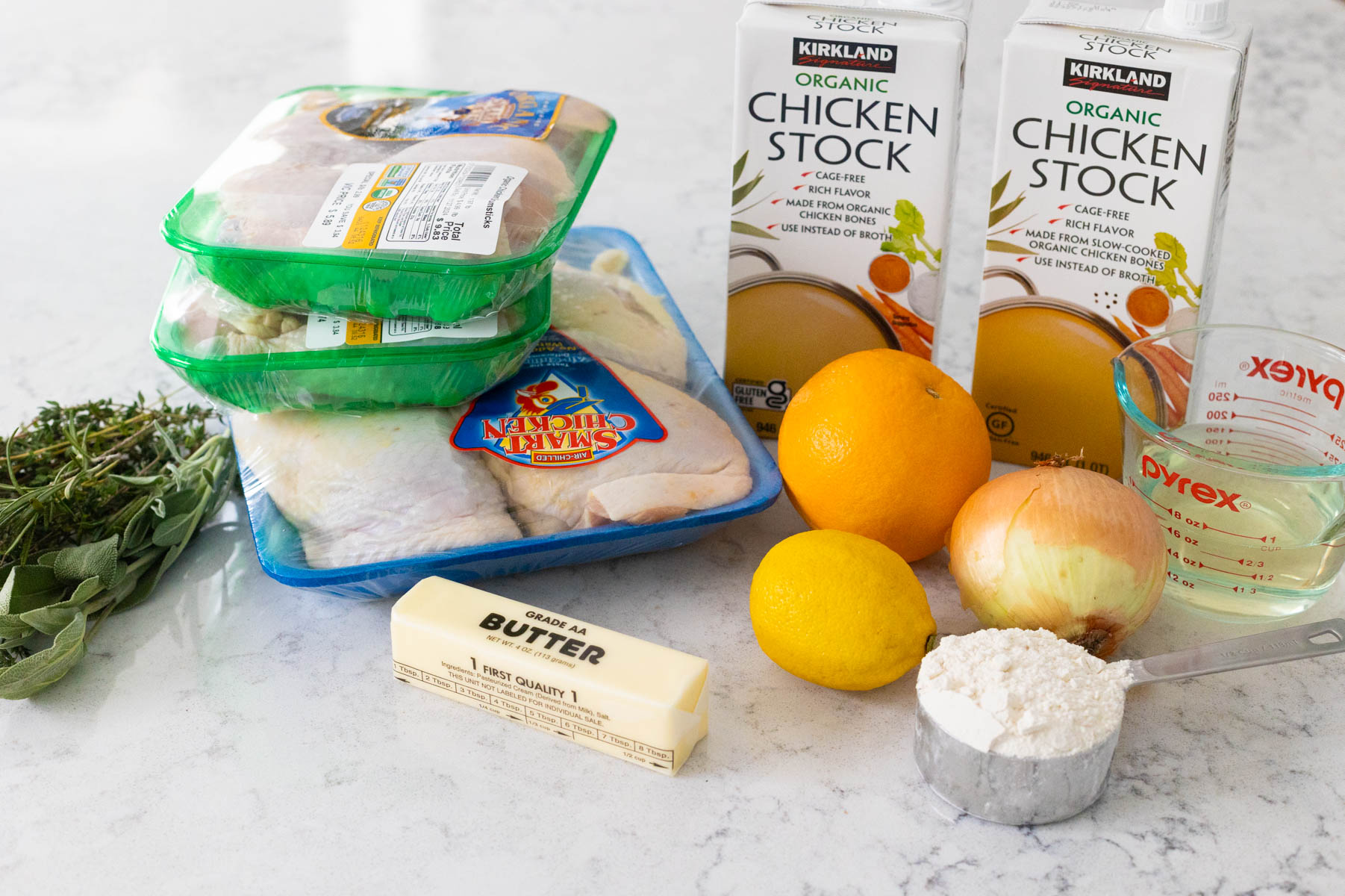 The ingredients to make roasted chicken leg quarters are on the counter.