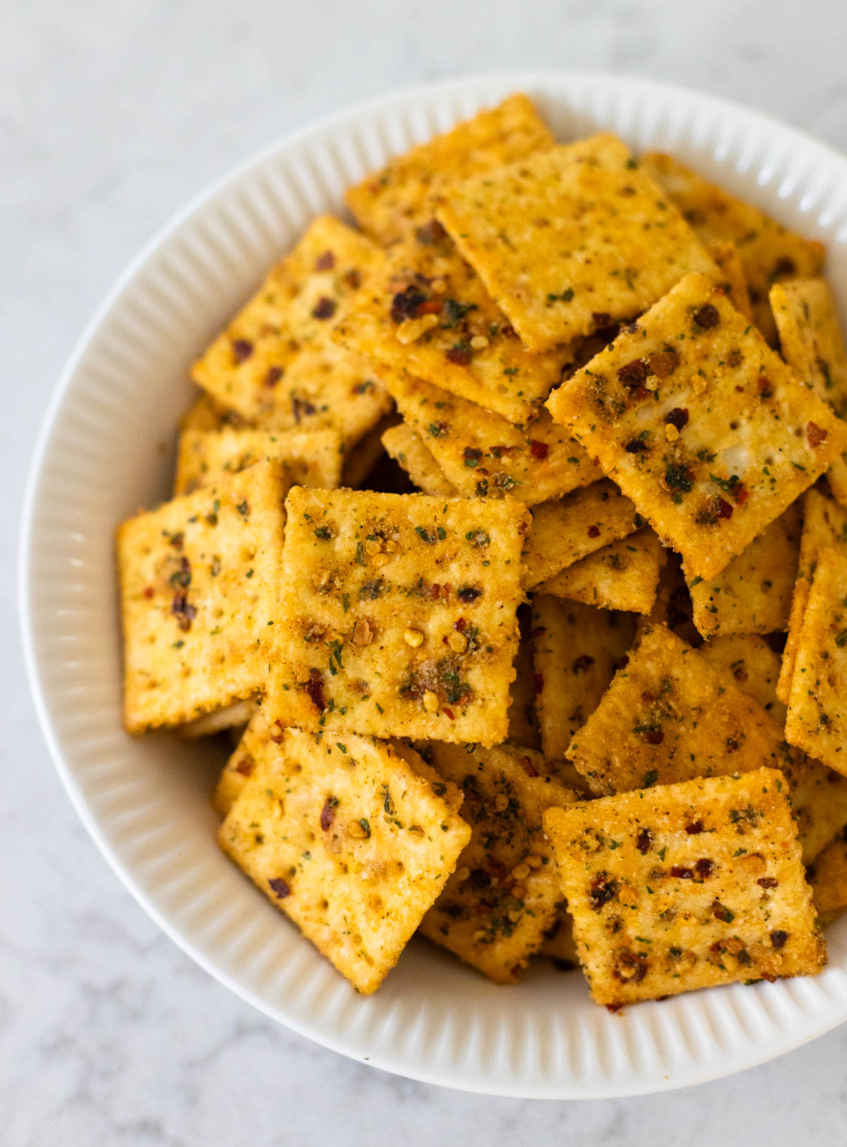 The white bowl is filled to the brim with seasoned Alabama firecrackers.