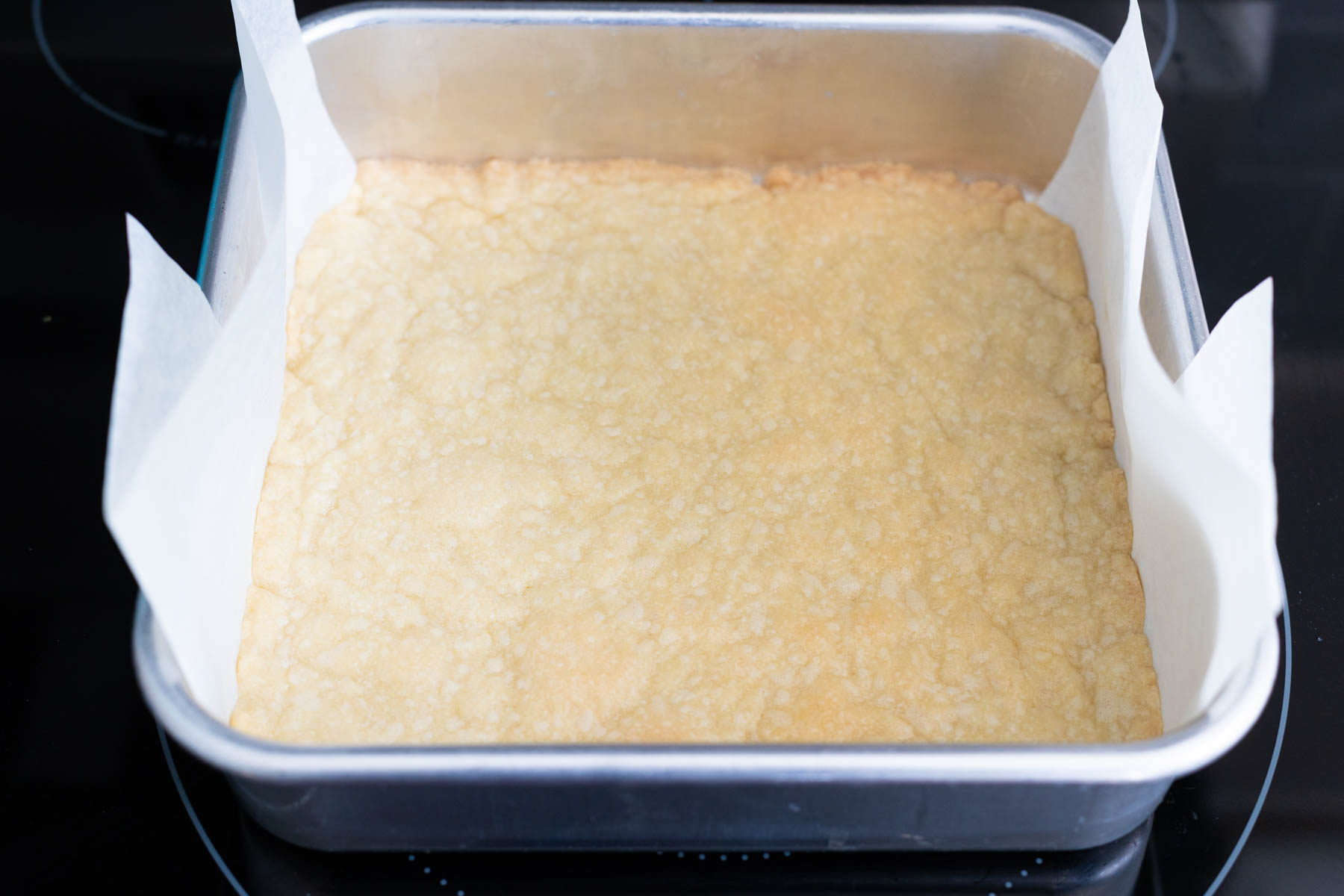 The crust is freshly out of the oven and a light golden brown at the edges.