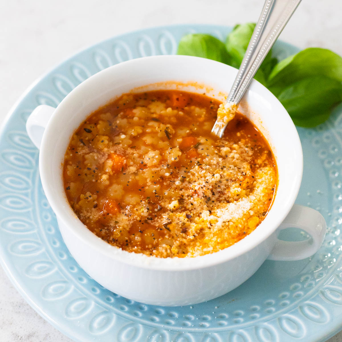 The pastina is served with a sprinkle of parmesan cheese over the top.