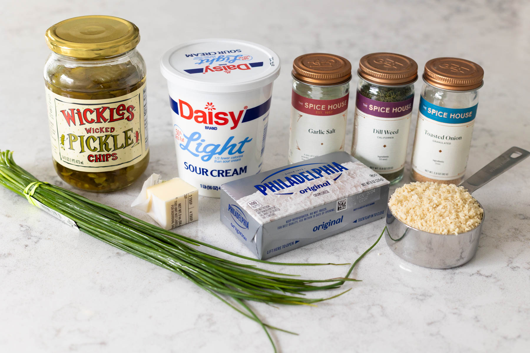 The ingredients to make the pickle dip are on the counter.