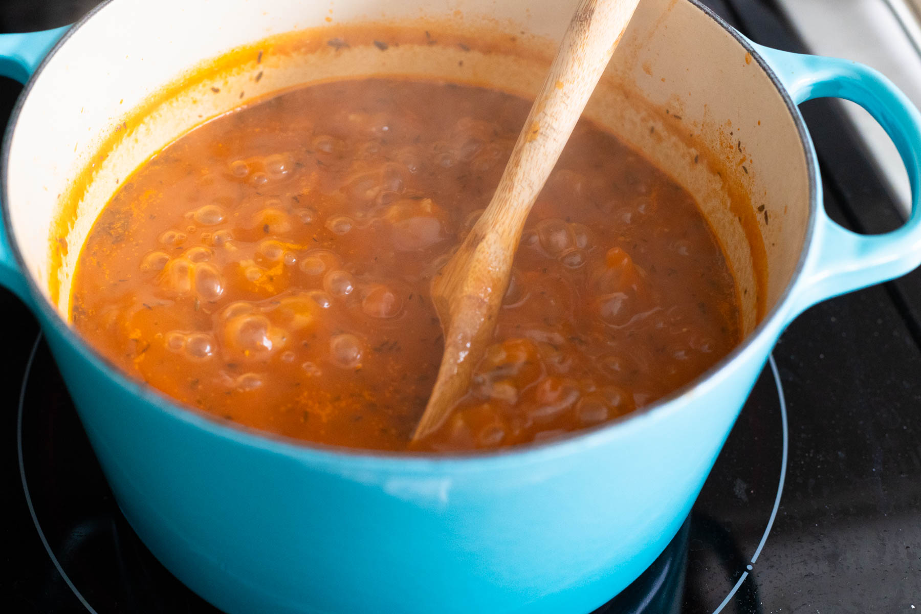The soup is nice and bubbly, the tiny pastina are cooking in the pot.