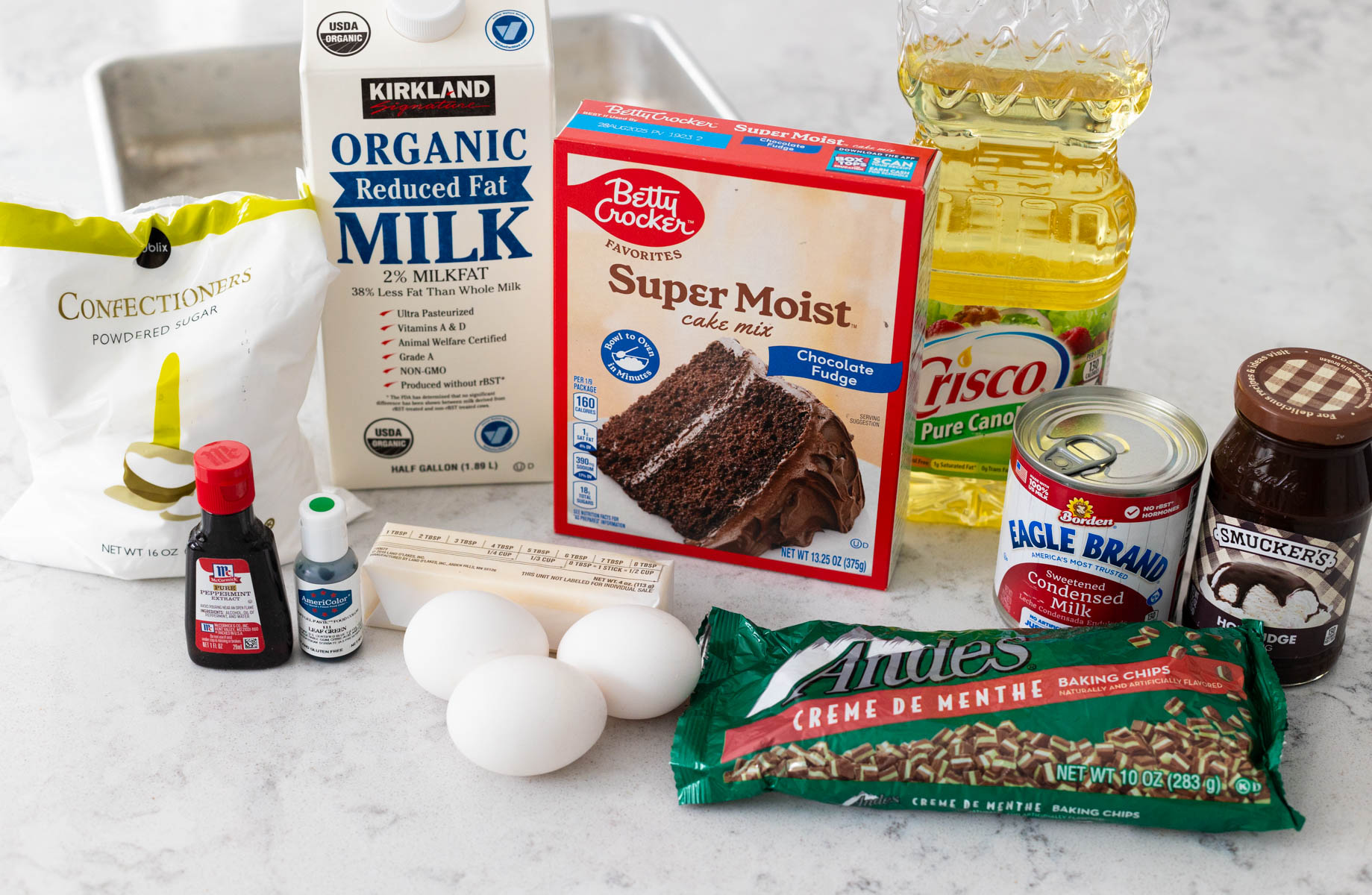 The ingredients to make the grasshopper cake are on the counter.