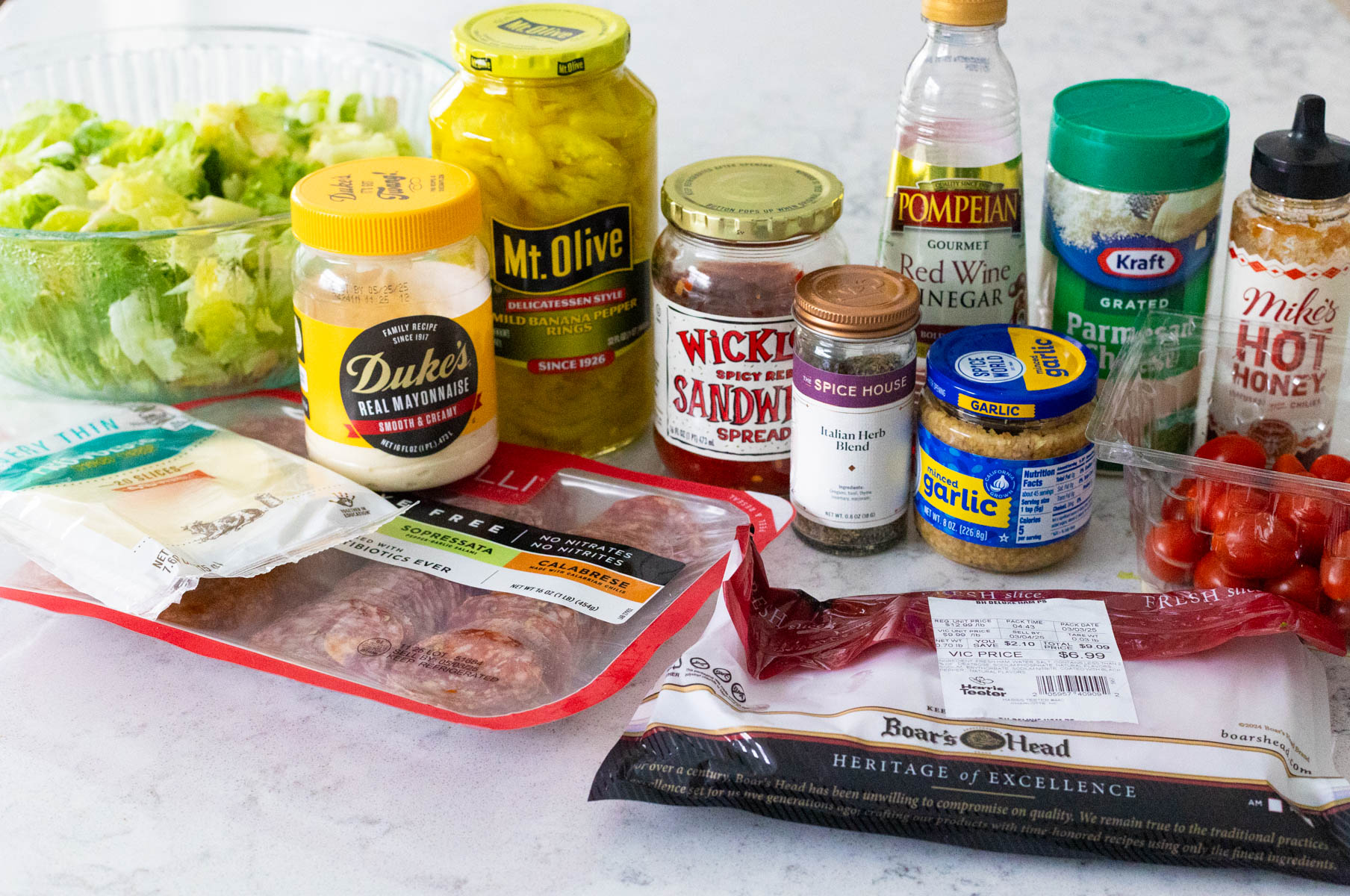 The ingredients to make the grinder salad are on the counter.