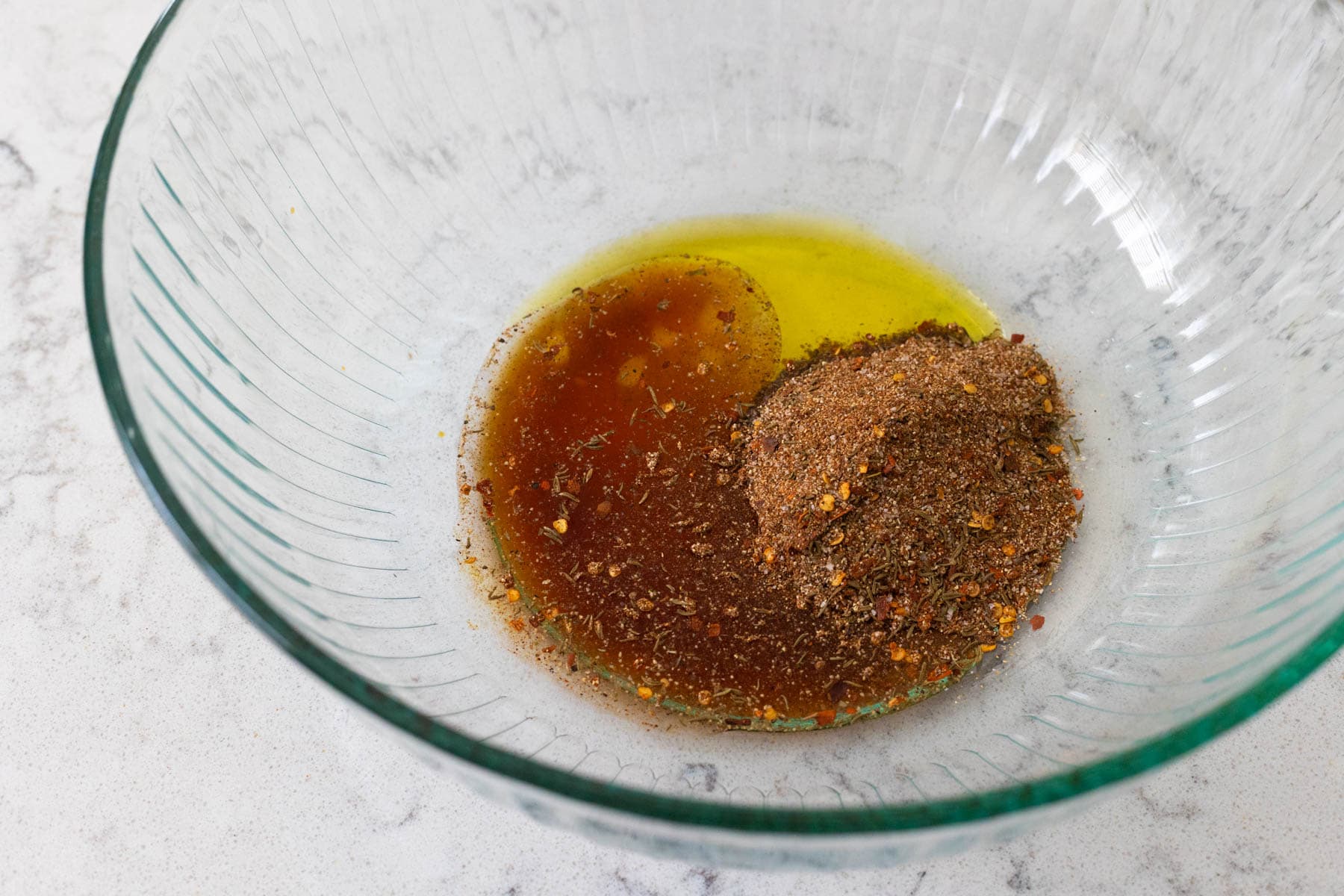 The marinade ingredients are in a large mixing bowl.