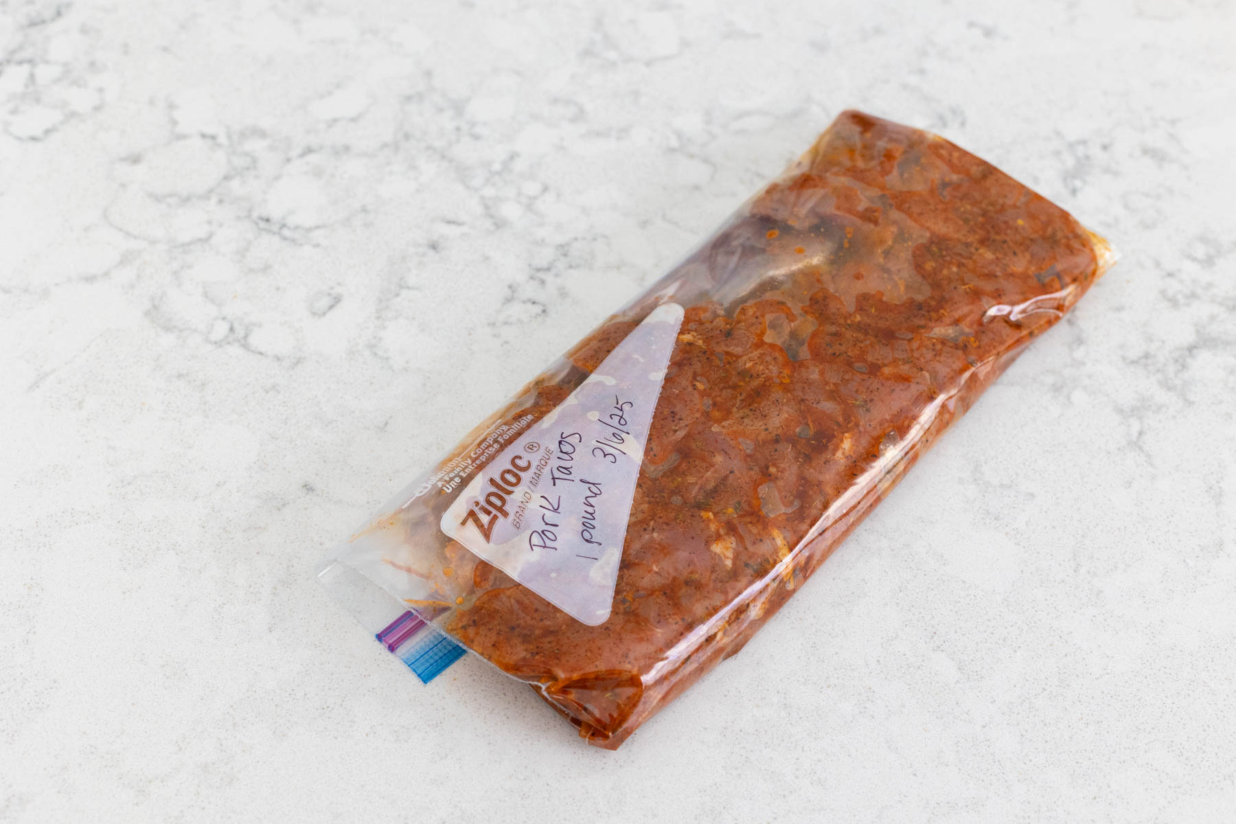 The marinated pork is in a freezer bag.