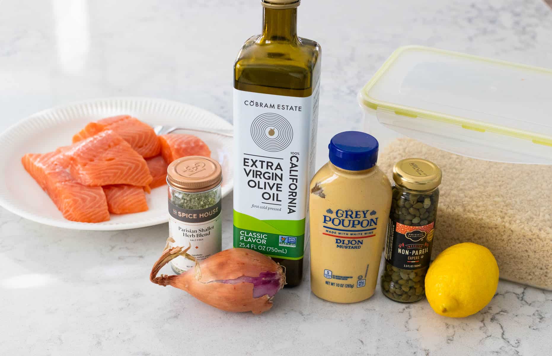 The ingredients to make the homemade salmon burgers are on the counter.