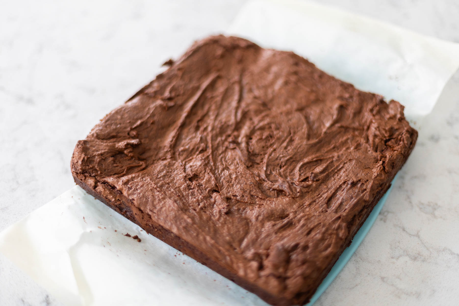 The baked brownies are out of the pan and cooling.