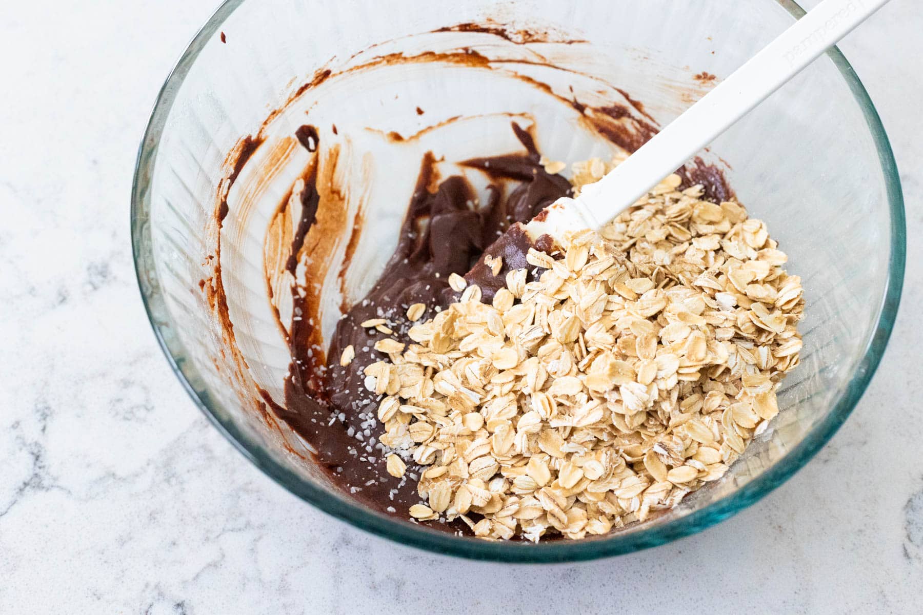 The oats have been added to the chocolate batter.