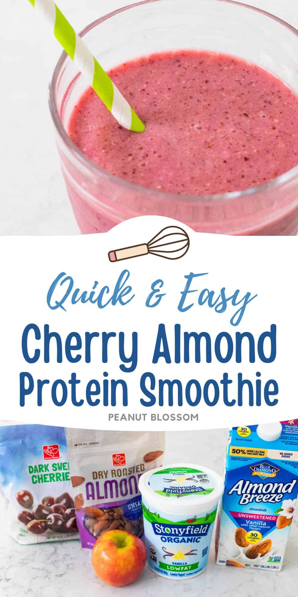 A red cherry almond smoothie in a cup with a striped straw has almonds scattered on the counter next to it.