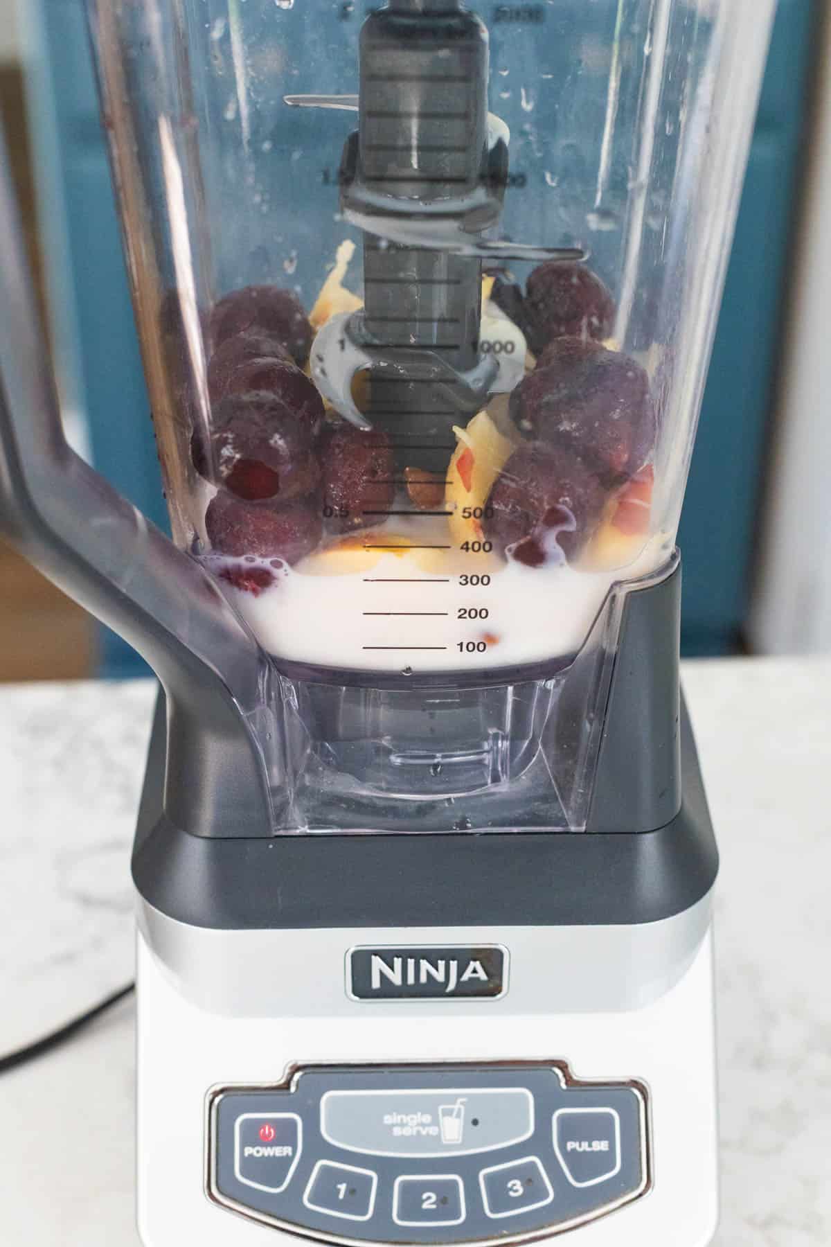 The cherries and almonds are in the blender.