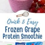 A deep purple grape smoothie in a cup with a straw and a cluster of grapes on the side.