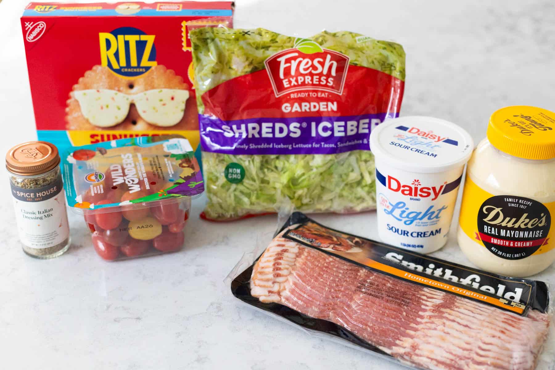 The ingredients to make the BLT dip are on the counter.