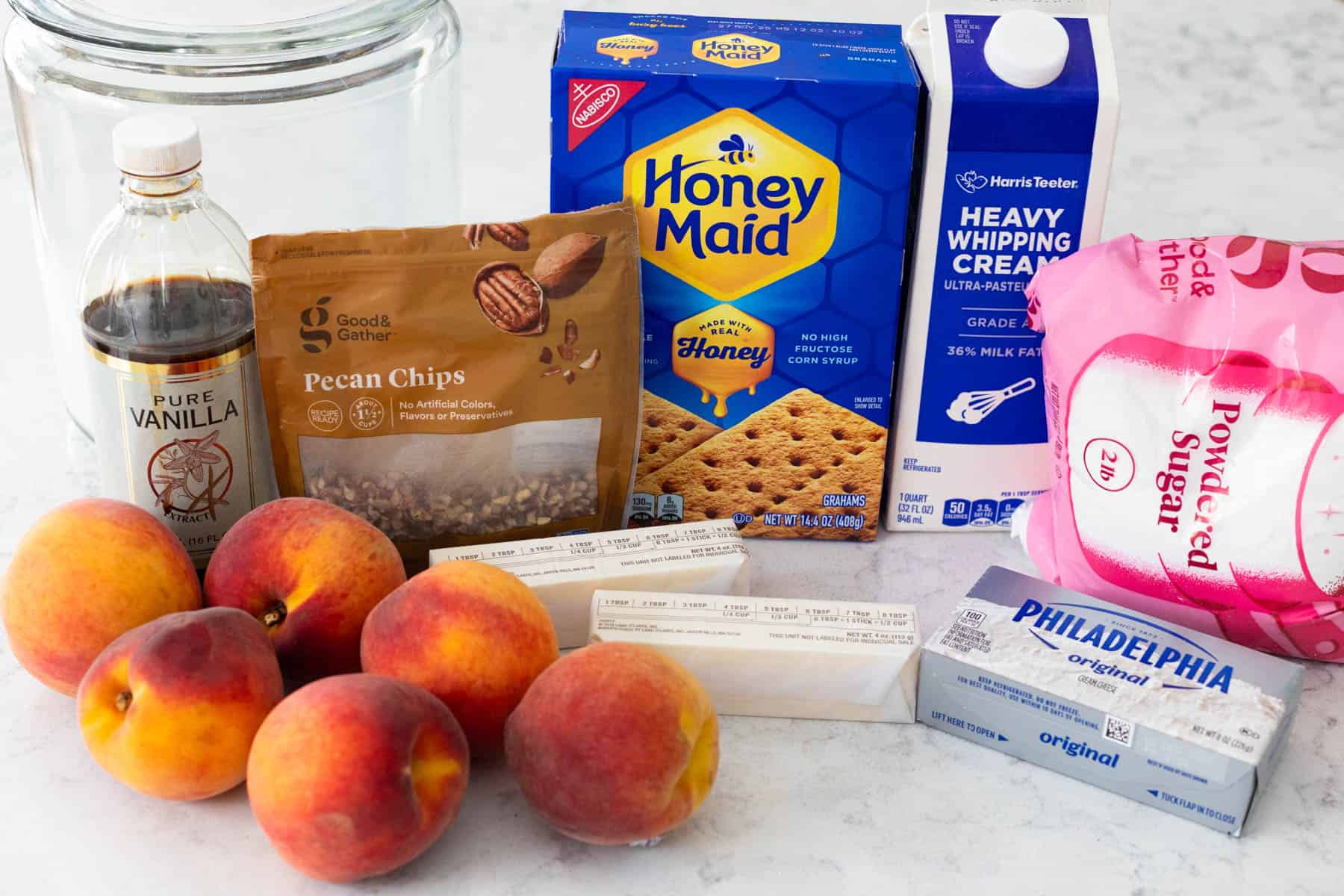 The ingredients to make the no-bake peach dessert are on the kitchen counter.