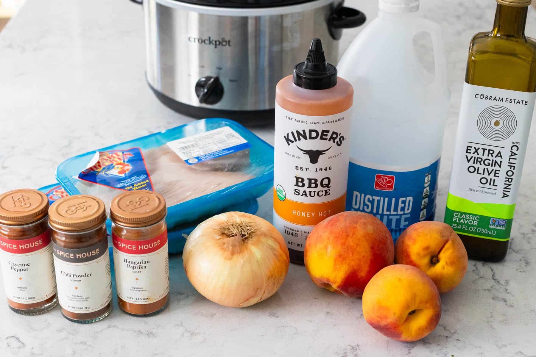 The ingredients for the peach chicken tacos are on the kitchen counter.
