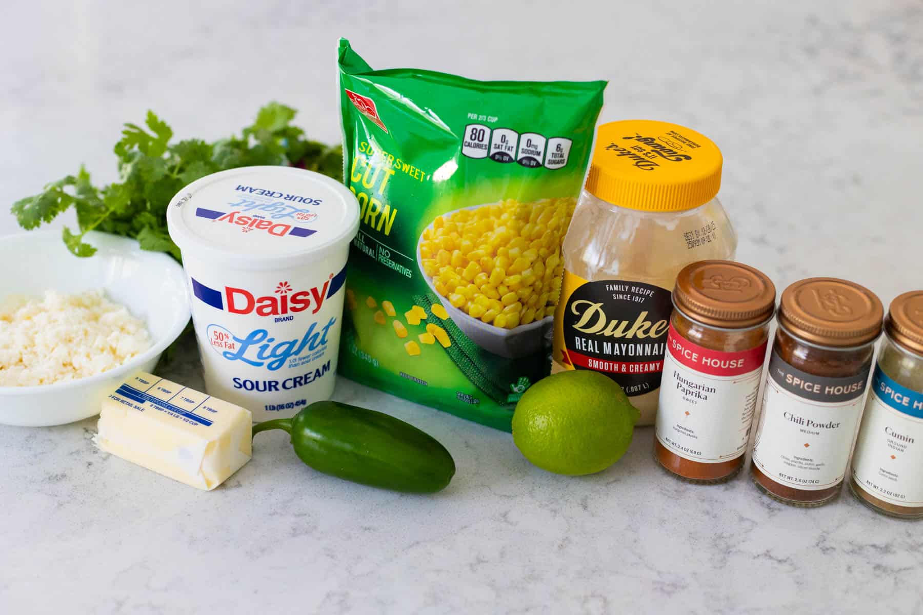 The ingredients to make Street Corn Dip are on the kitchen counter.