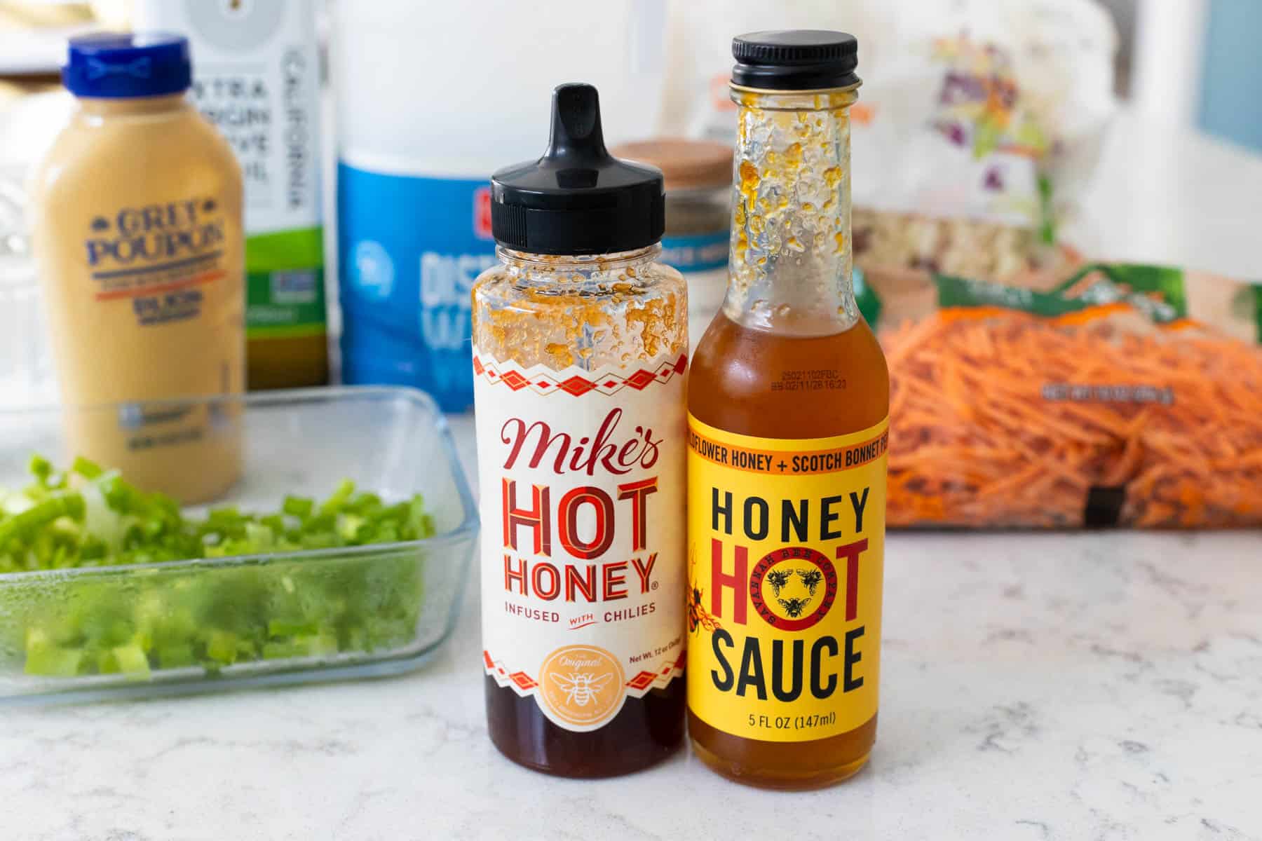 Two different hot honeys are shown as options to include in the slaw.