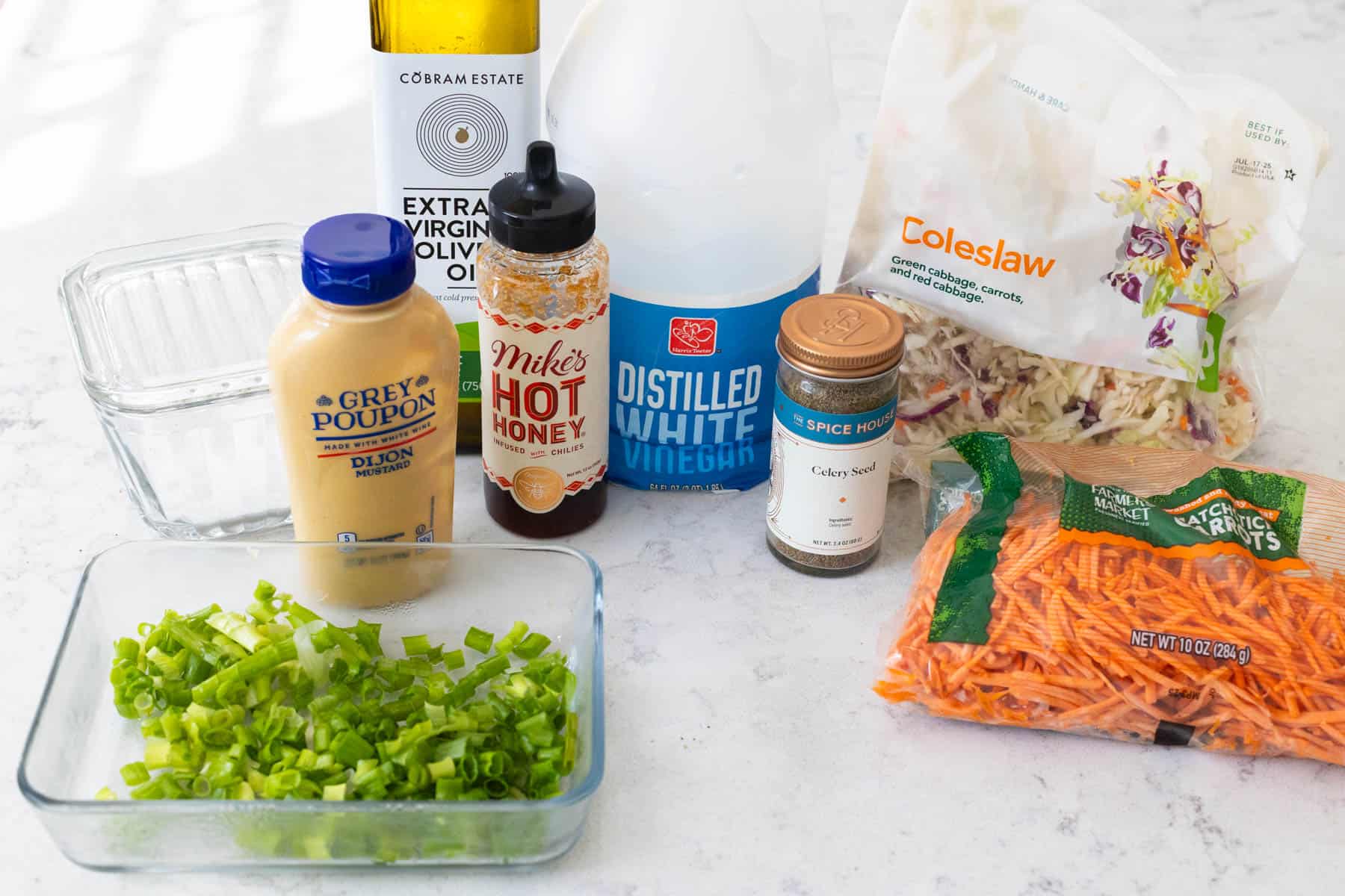 The ingredients to make the vinegar slaw are on the kitchen counter.