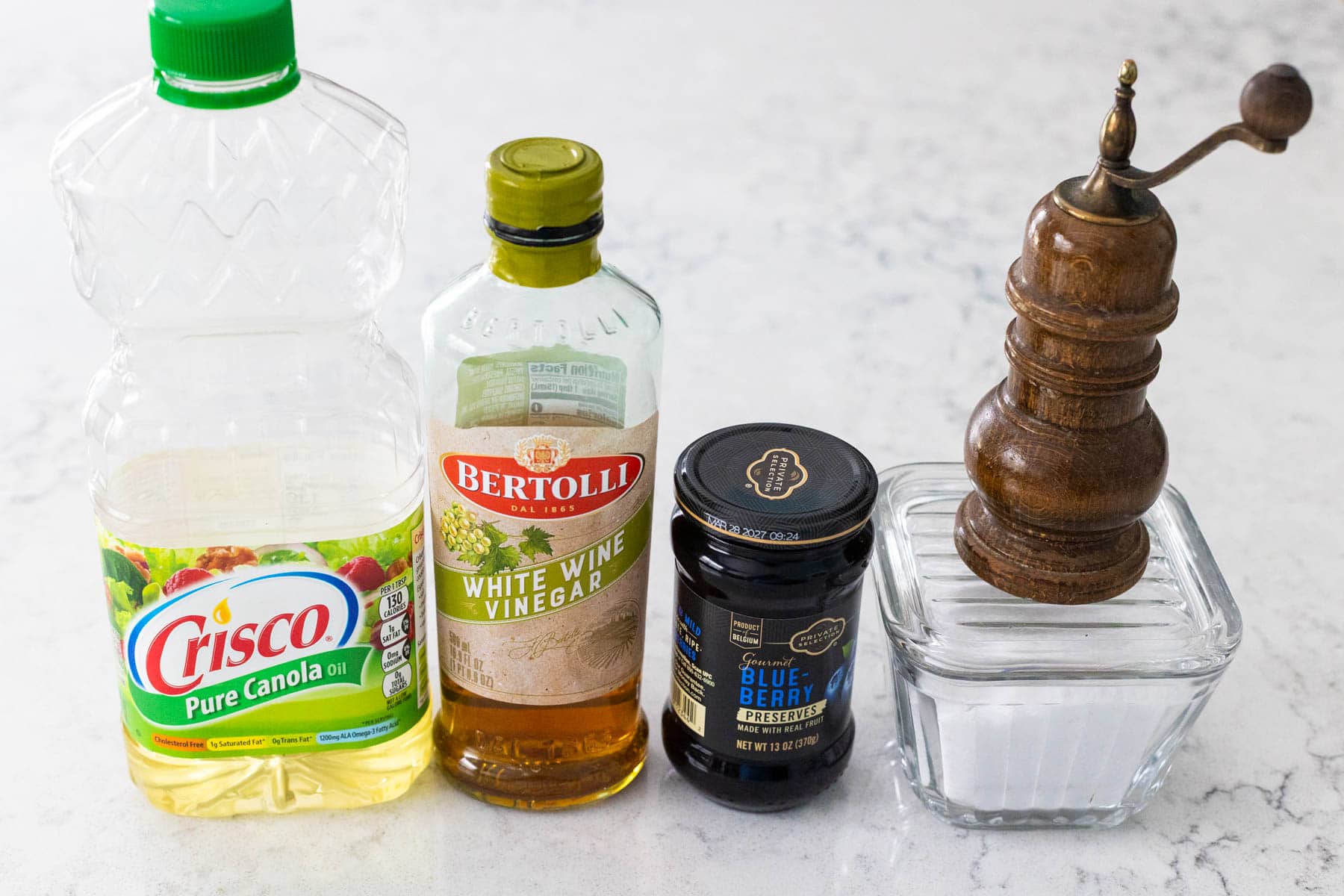 The simple ingredients to make the homemade dressing are lined up on the counter.