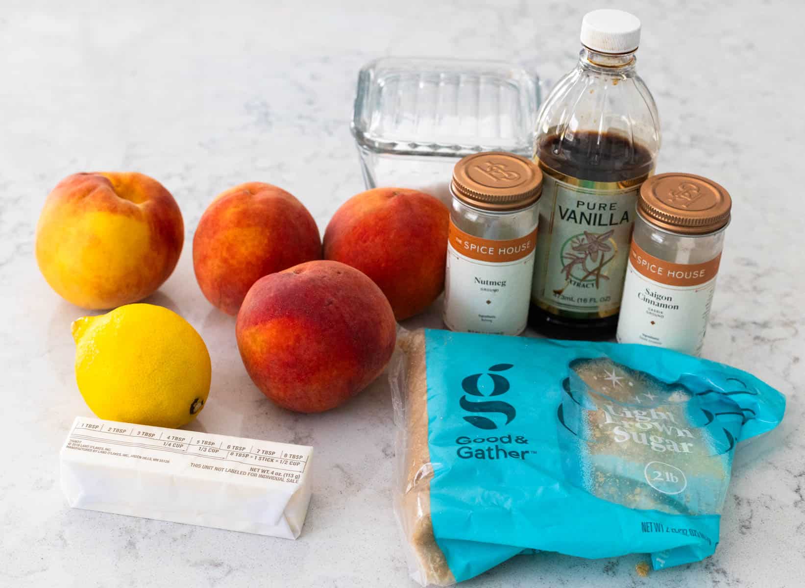 The ingredients to make Skillet Fried Peaches are on the kitchen counter.