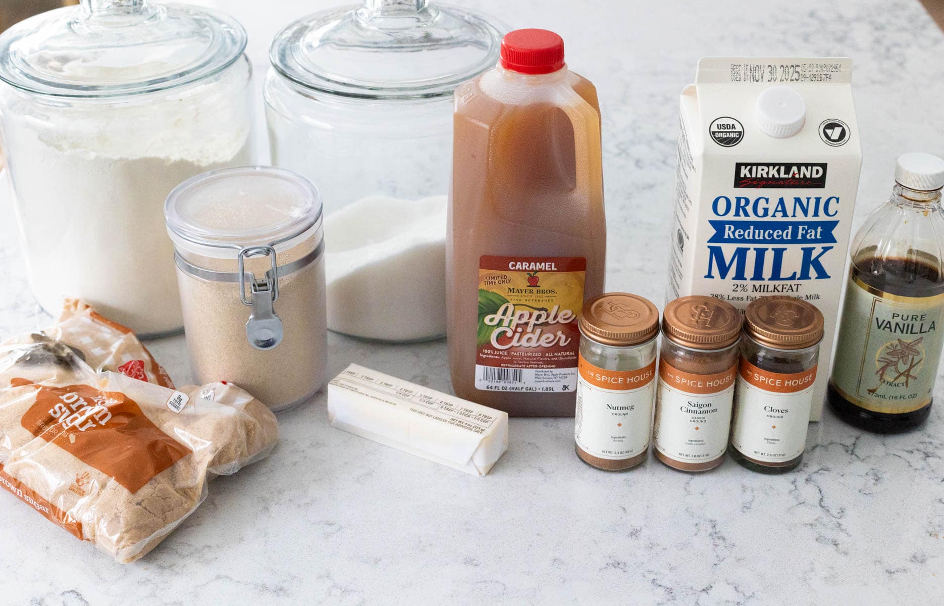 The ingredients to make Apple Cider Cinnamon Rolls are on the kitchen counter.