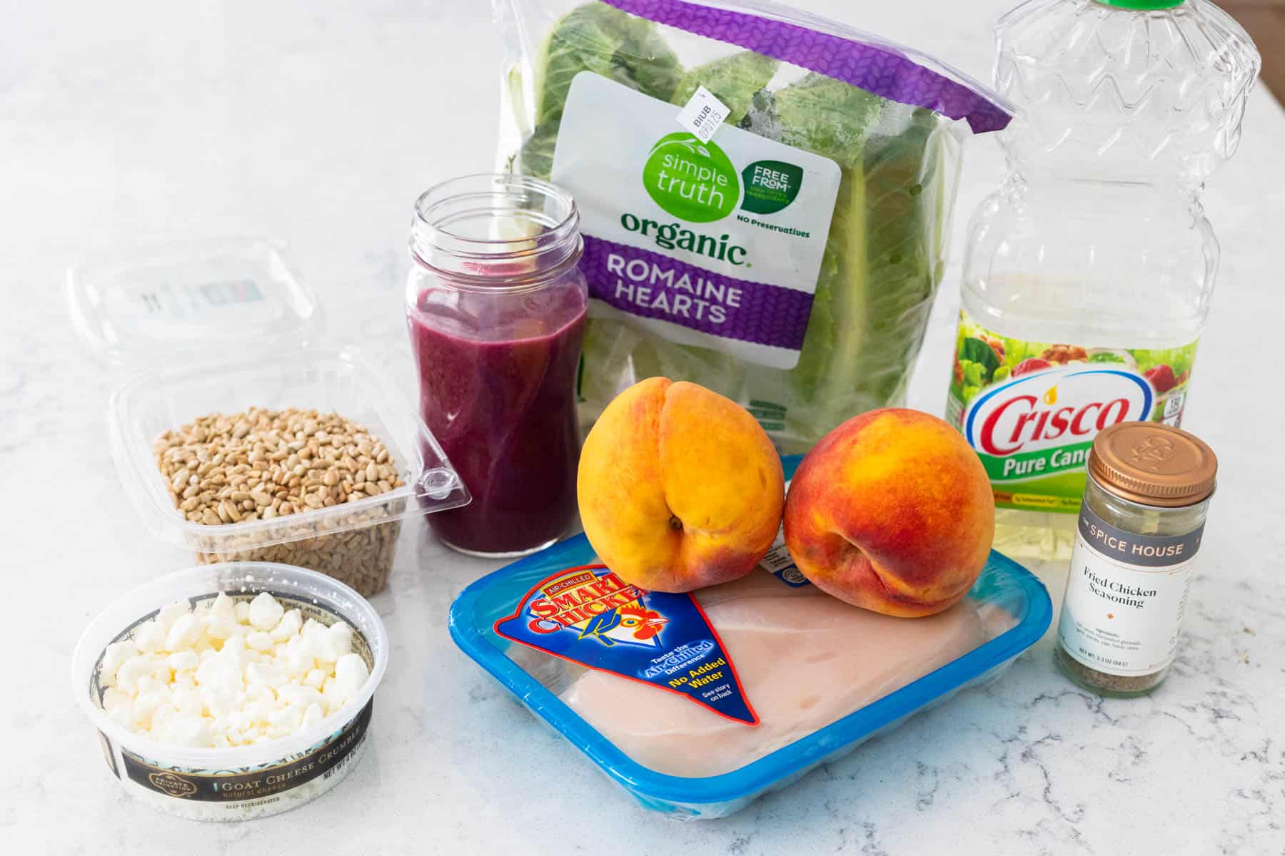 The ingredients to make Chicken Peach Salad are on the kitchen counter.