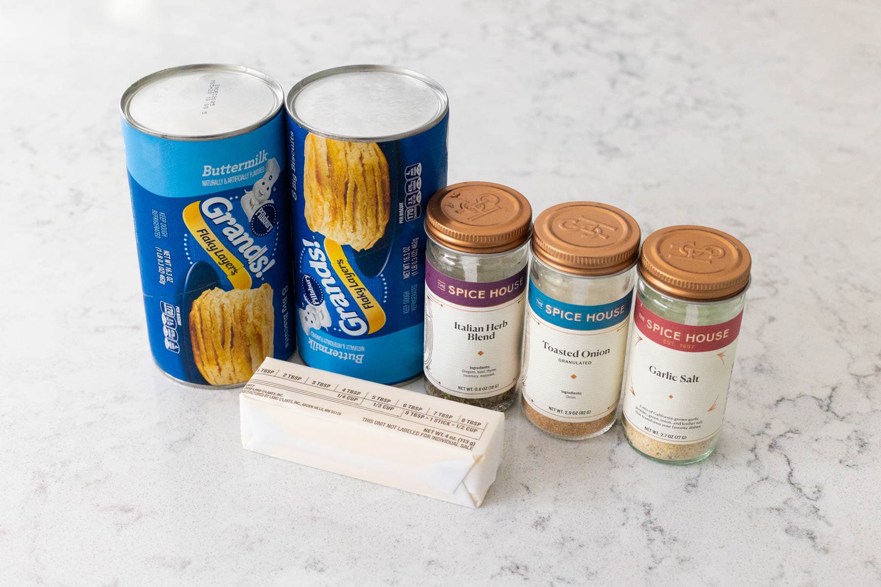 The ingredients to make Herb Butter Biscuits are on the kitchen counter.