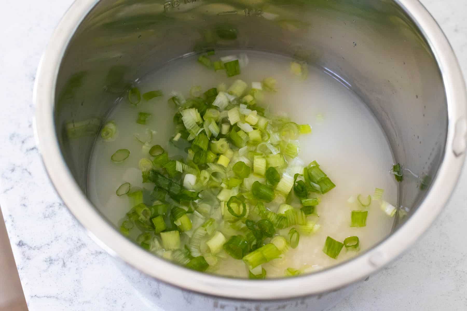 A Bowl filled with Chopped Scallions