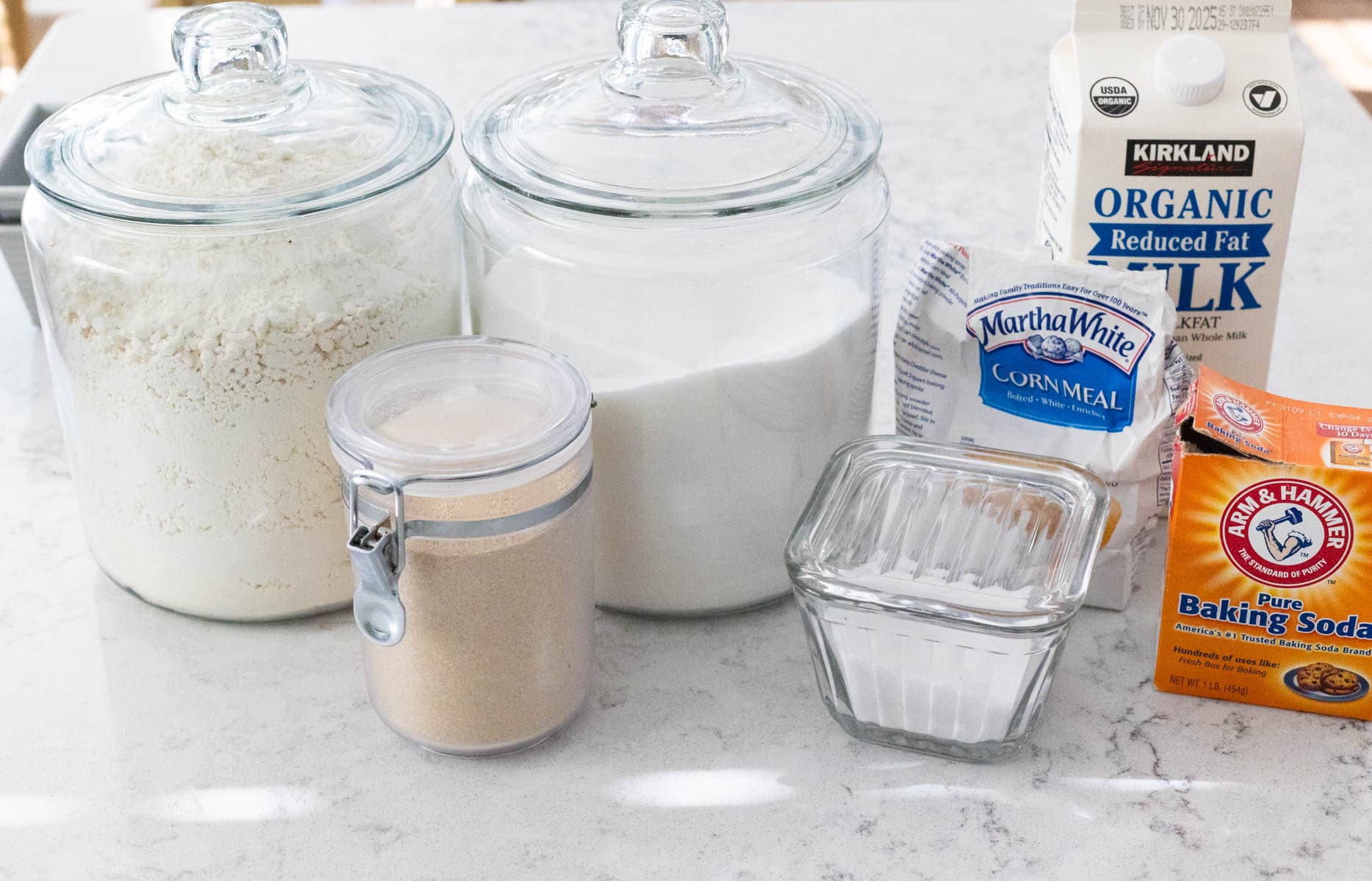 The ingredients to make English Muffin Bread are on the kitchen counter.