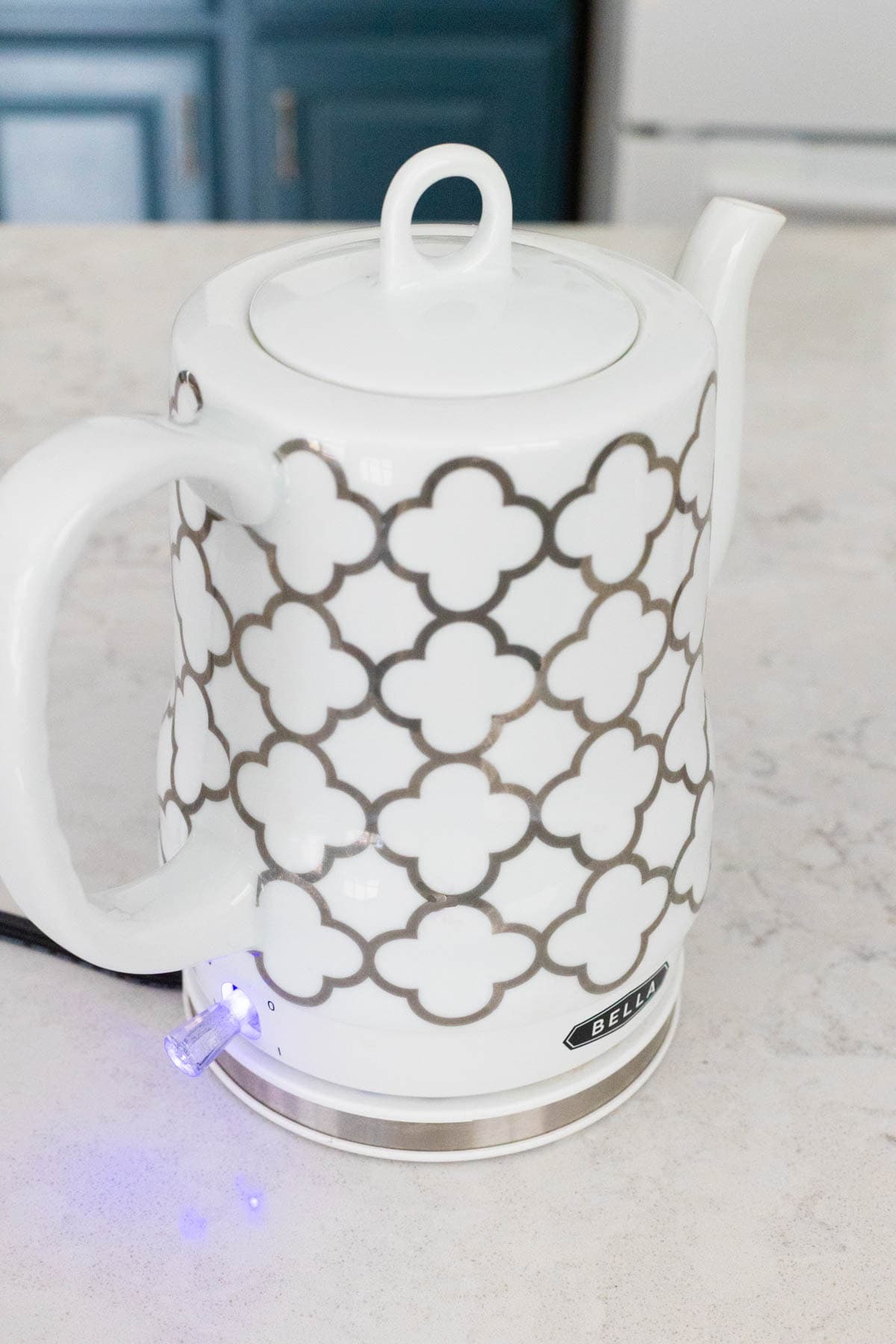 An electric tea kettle is boiling water for tea.