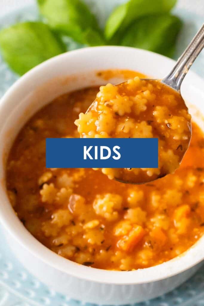 A bowl of star shaped pasta in tomato sauce has the caption "Kids" overlayed on top.