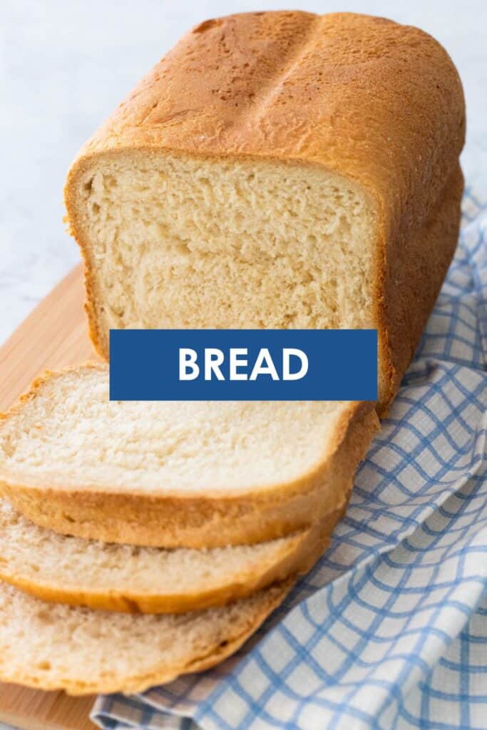 A loaf of sliced bread on a blue and white napkin has the caption "Bread" overlayed on top.