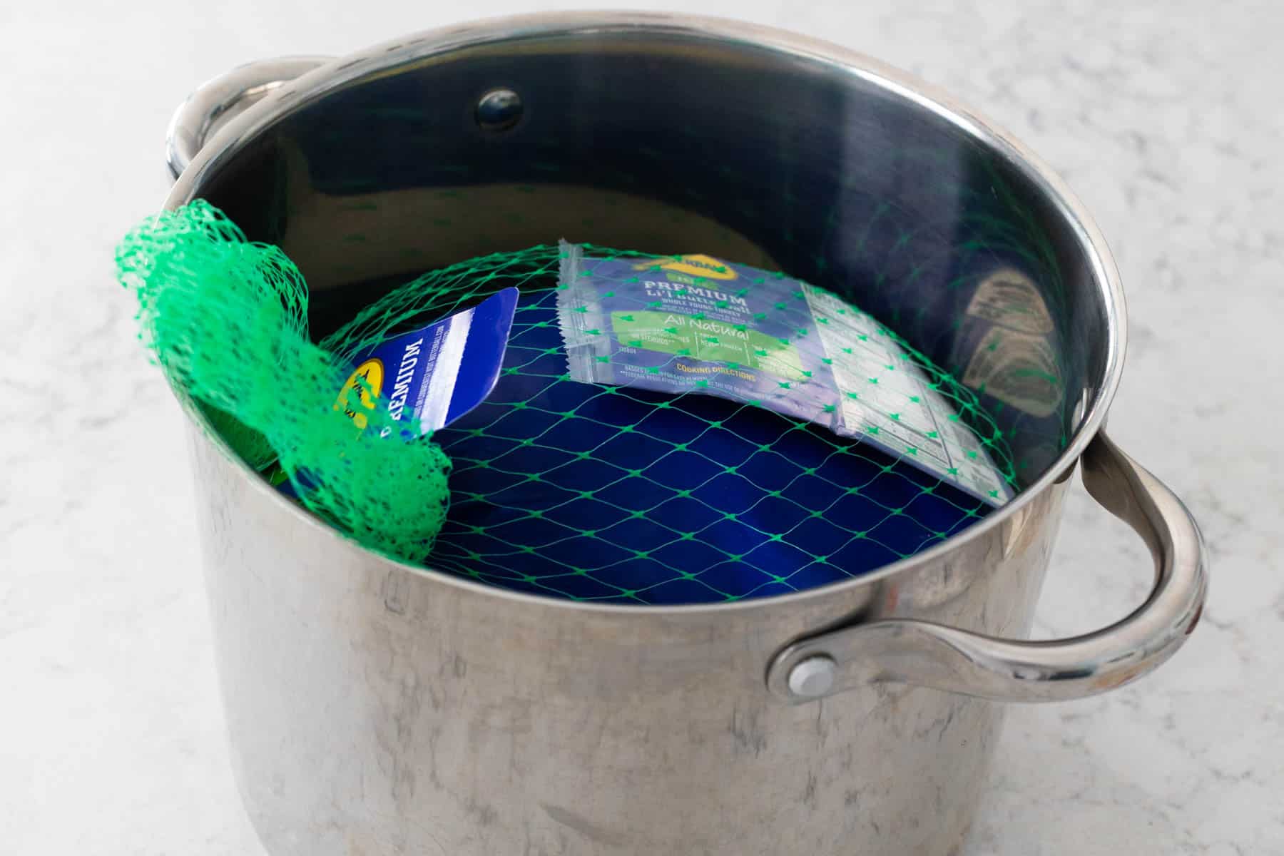 The turkey is in a pot that is just the right size.