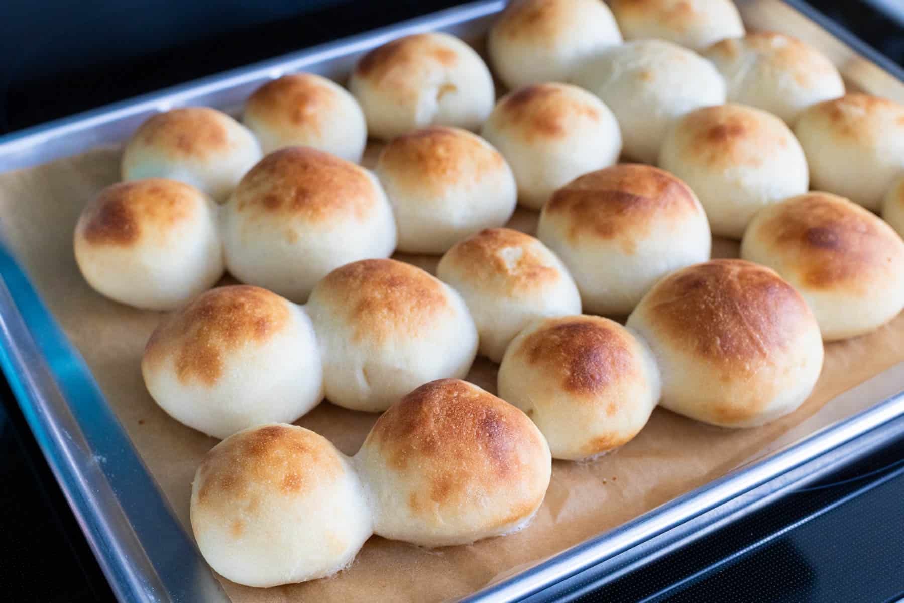 The golden brown dinner rolls are fresh from the oven.