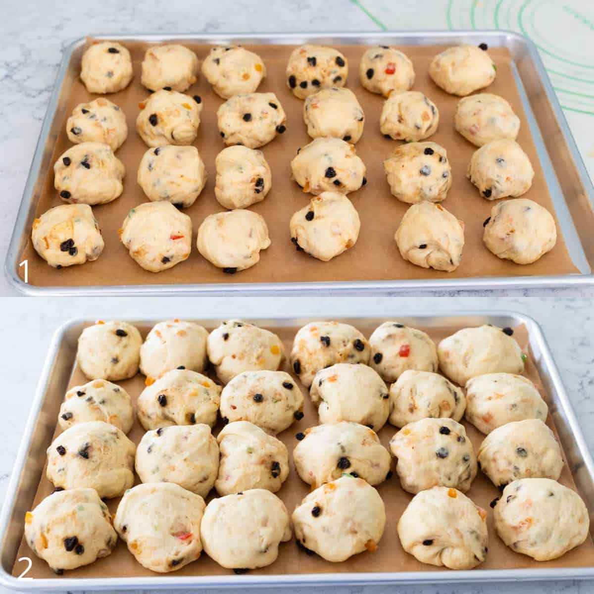 Two trays of fruit-filled Stollen bun dough balls, with the top tray showing freshly shaped pieces and the bottom tray showing the buns after rising.