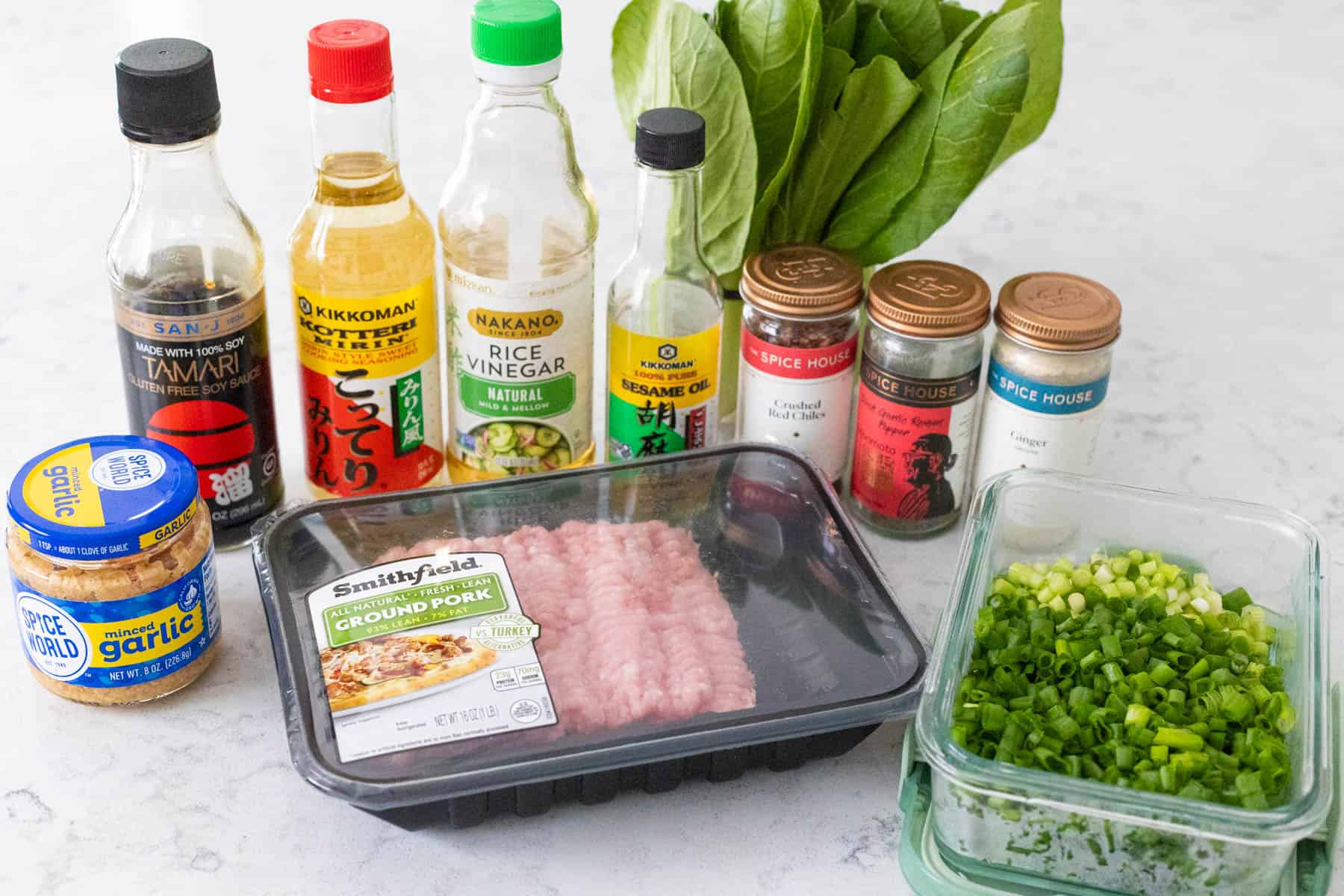 The ingredients to make Ground Pork Rice Bowls with Potsticker Sauce are on the kitchen counter.