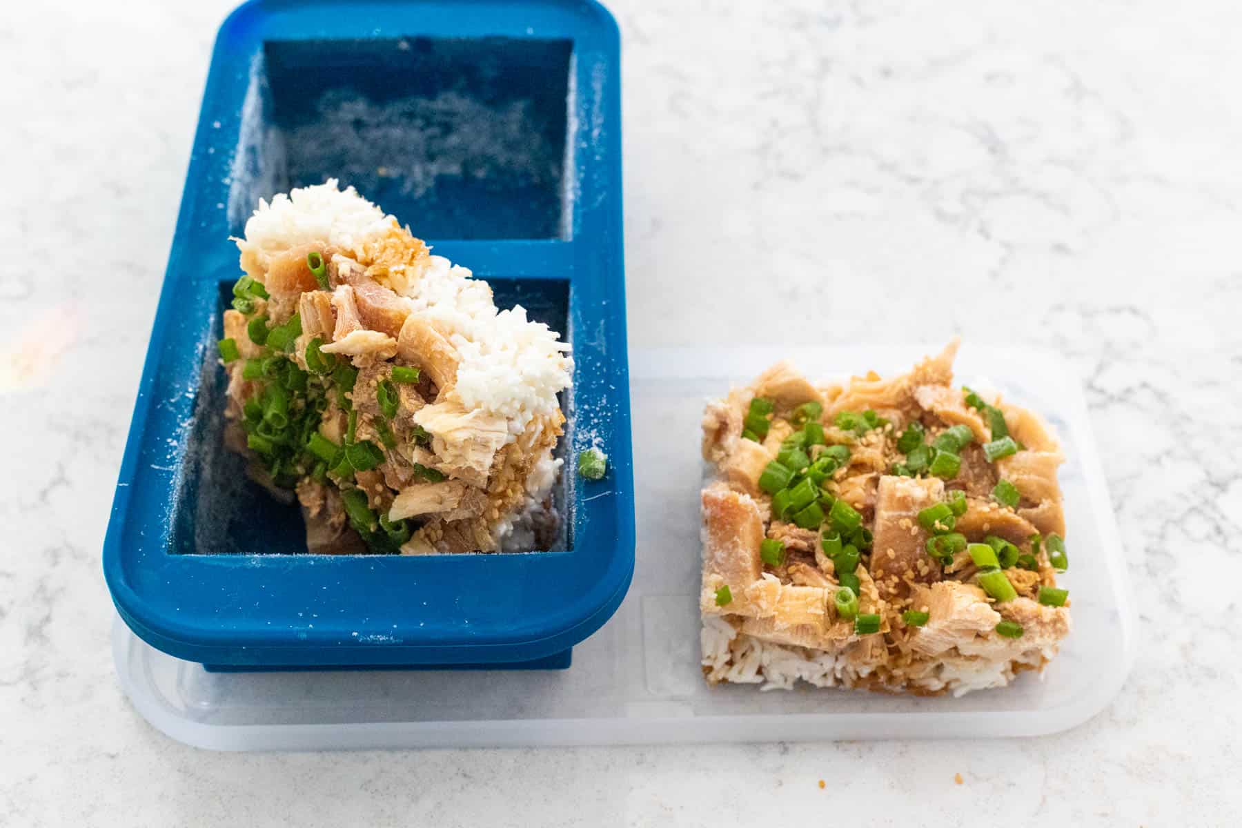 The teriyaki chicken rice bowls have been portioned into freezer containers for meal prep.