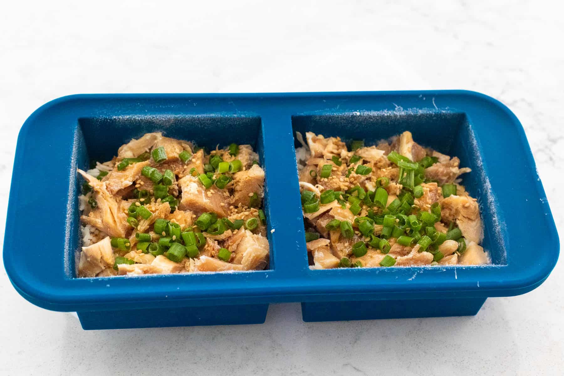 The Rotisserie teriyaki chicken rice bowls have been portioned into freezer containers for meal prep.