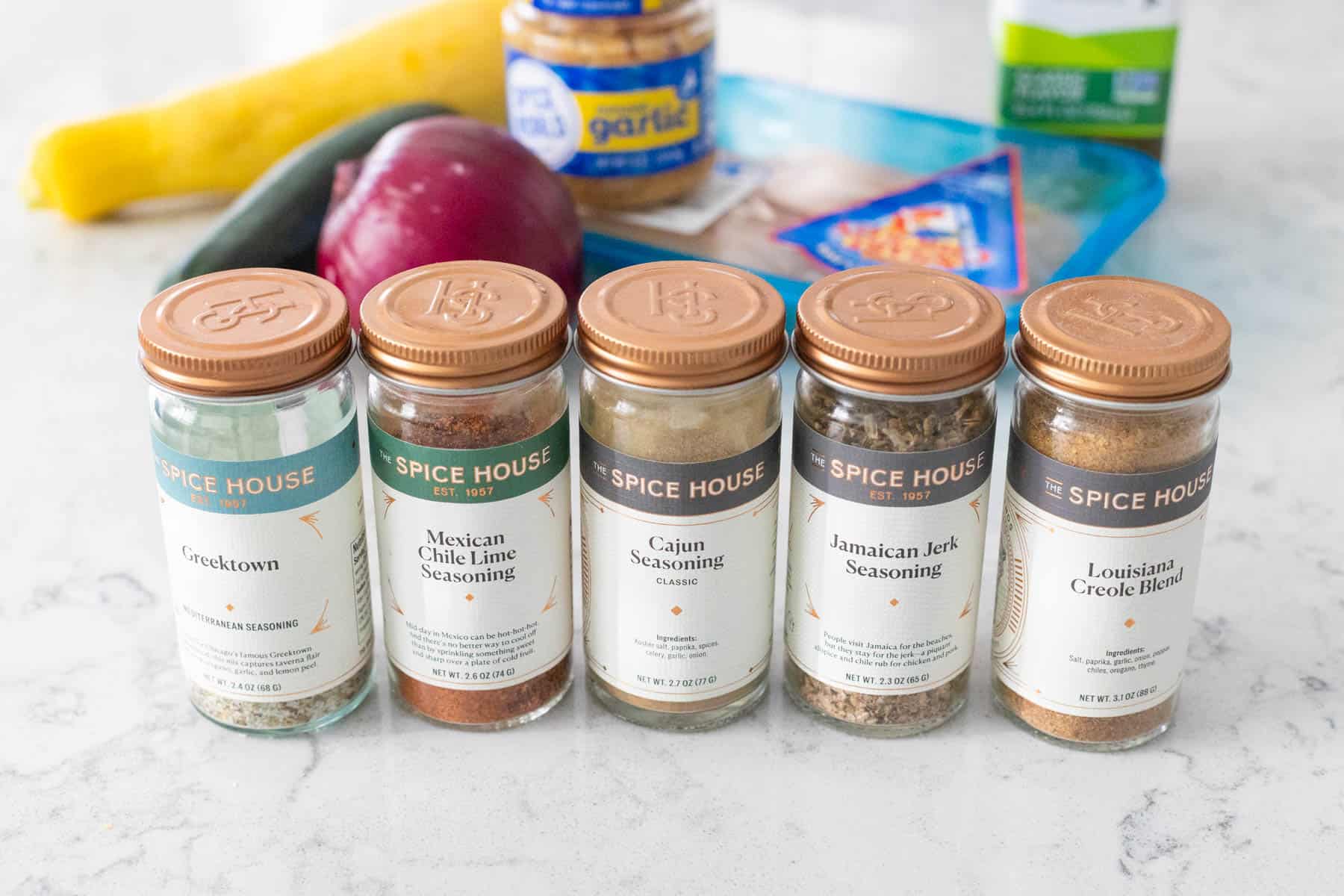 The ingredients to make Seasoned Chicken and Vegetables are on the kitchen counter.