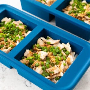 The teriyaki chicken rice bowls have been portioned into freezer containers for meal prep.