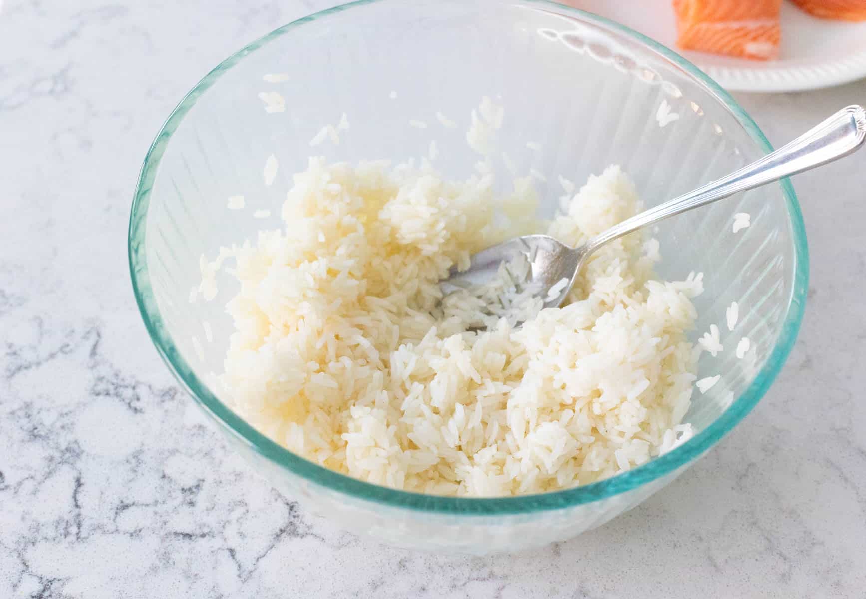 A bowl of cooked white rice.