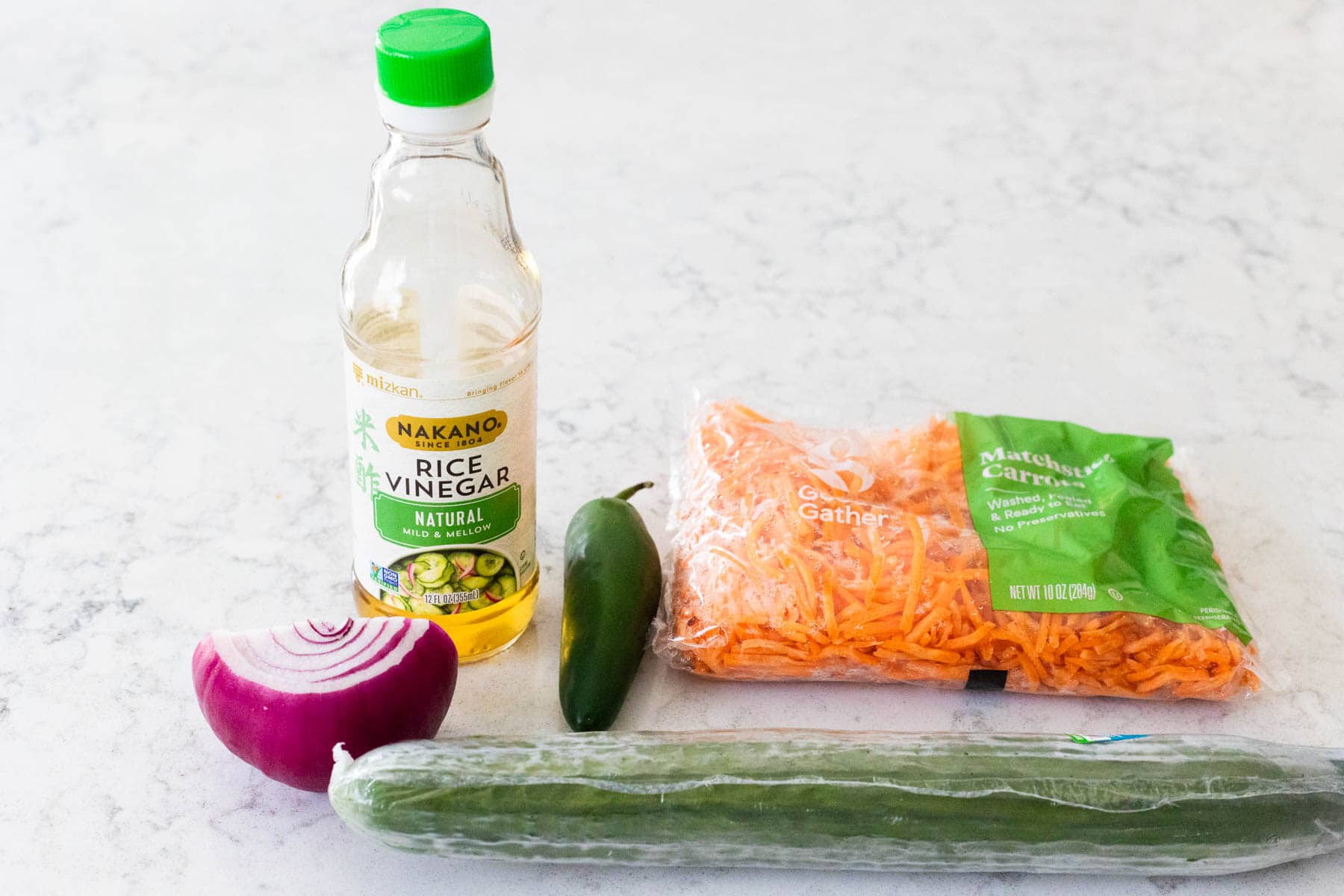 The ingredients to make Quick Pickled Vegetables are on the kitchen counter.