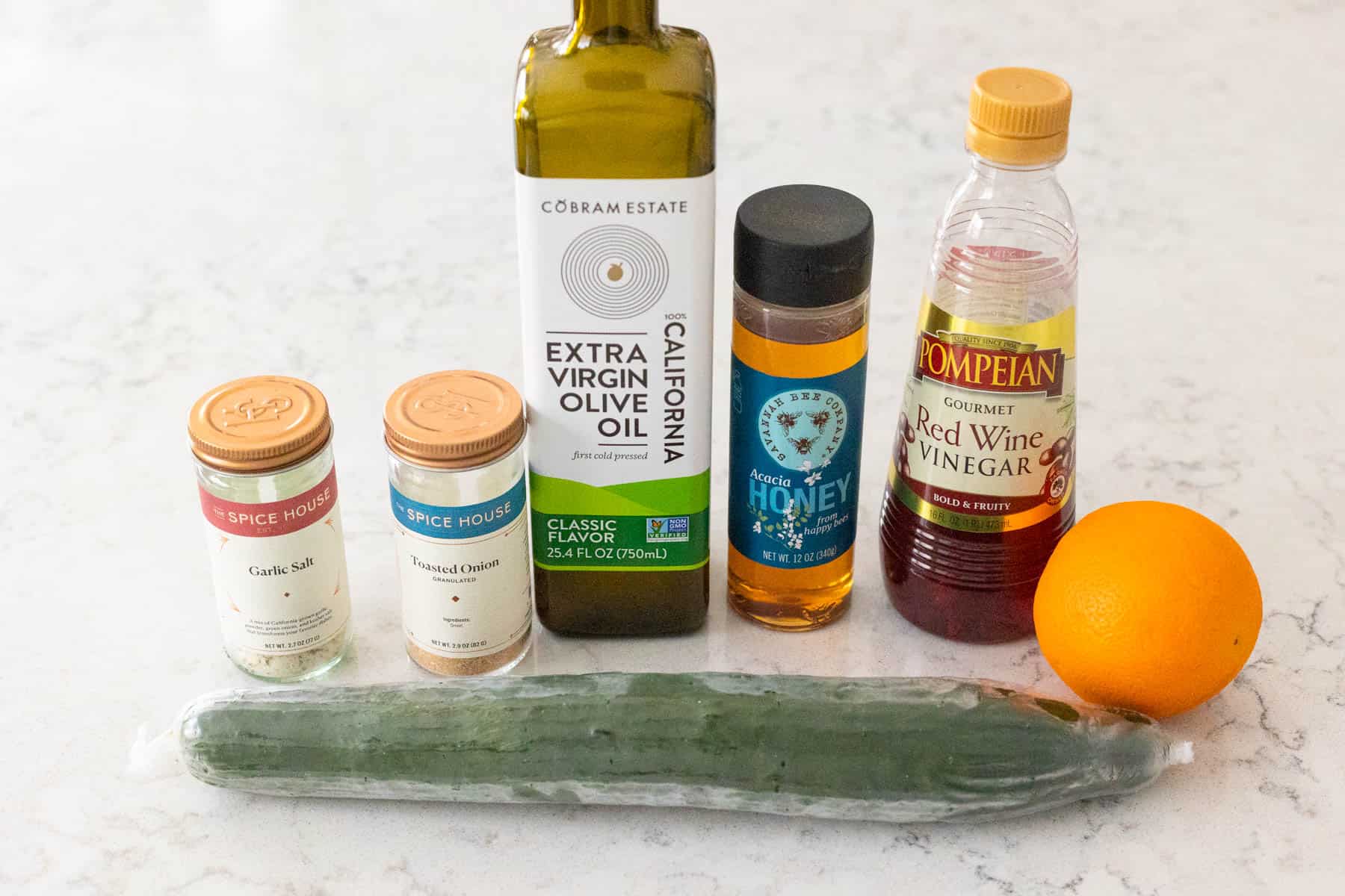 The ingredients to make Zesty Cucumber Salad are on the kitchen counter.