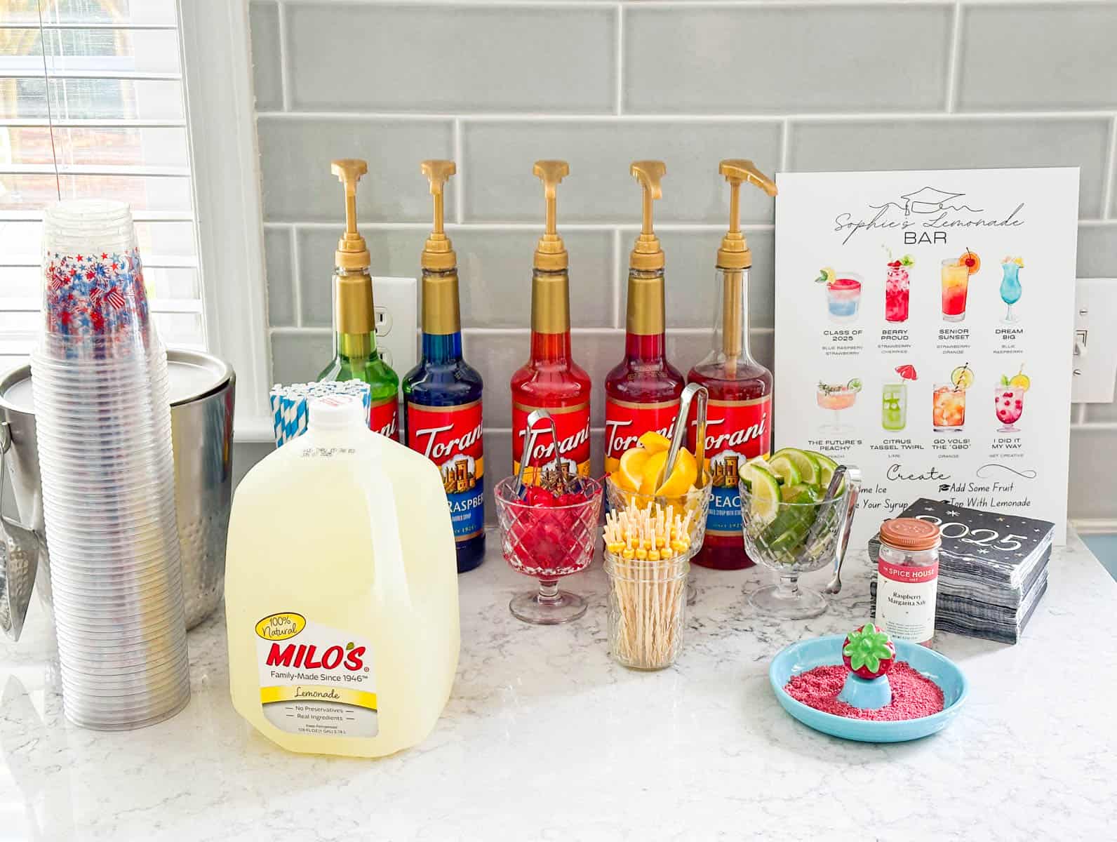 The set up of the lemonade bar on the counter.