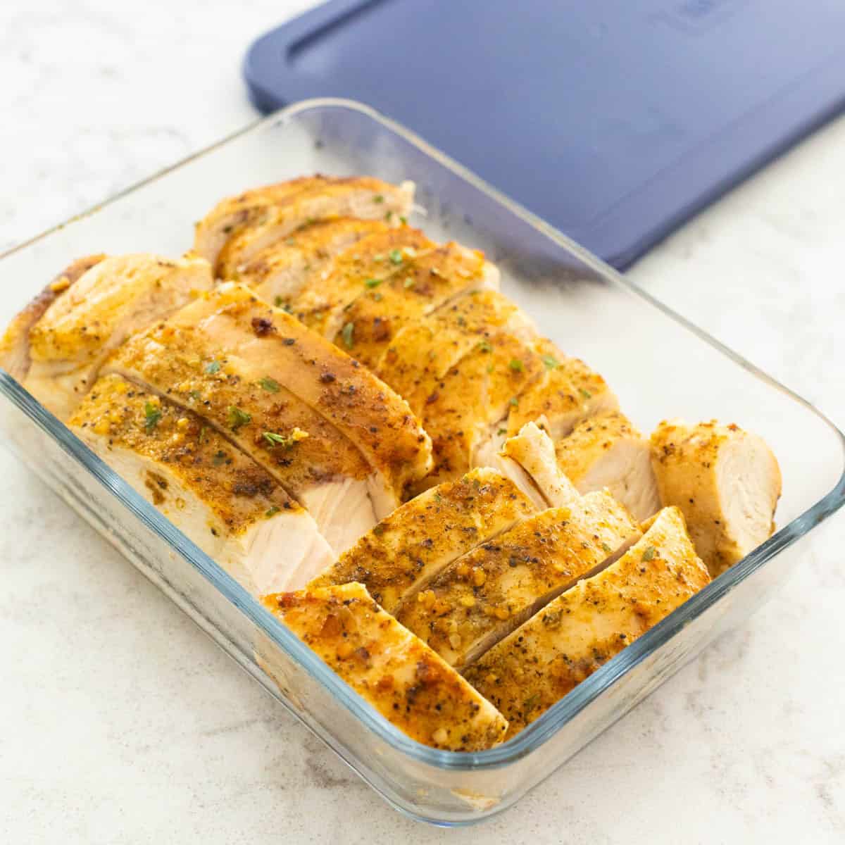 The pre-sliced chicken has been tucked into a meal prep container for the fridge.