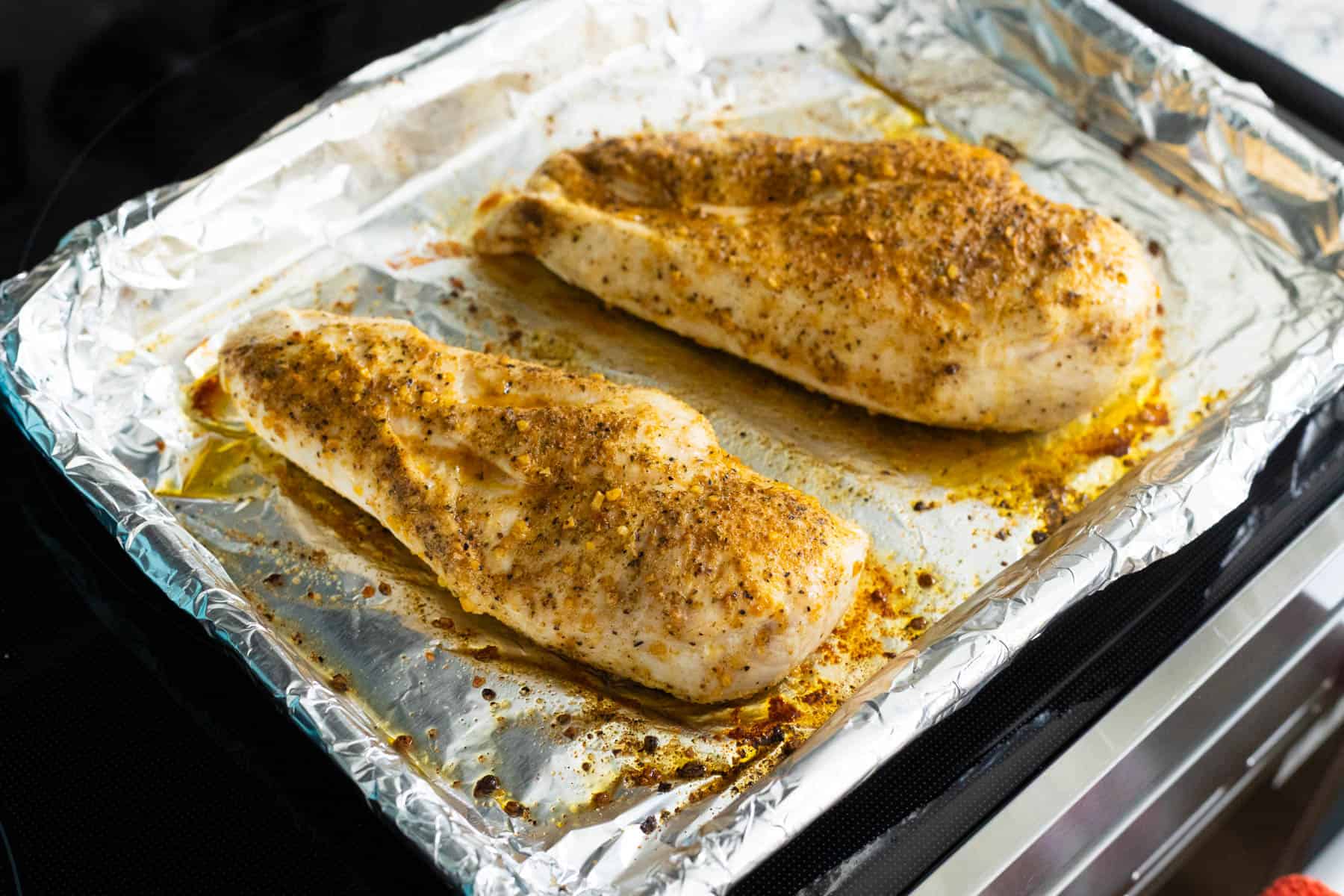 The baked chicken breasts are fresh out of the oven.