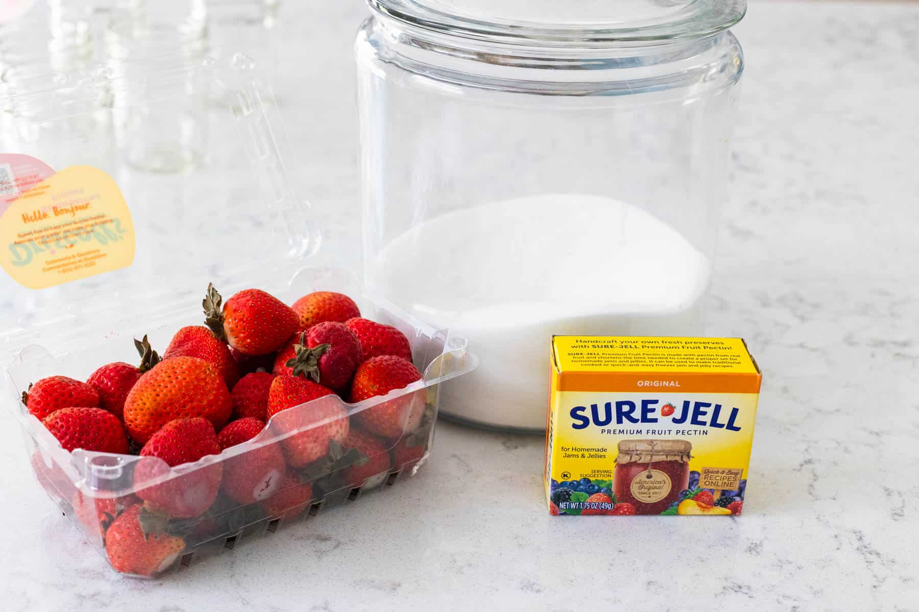 The ingredients to make the jam are on the counter.