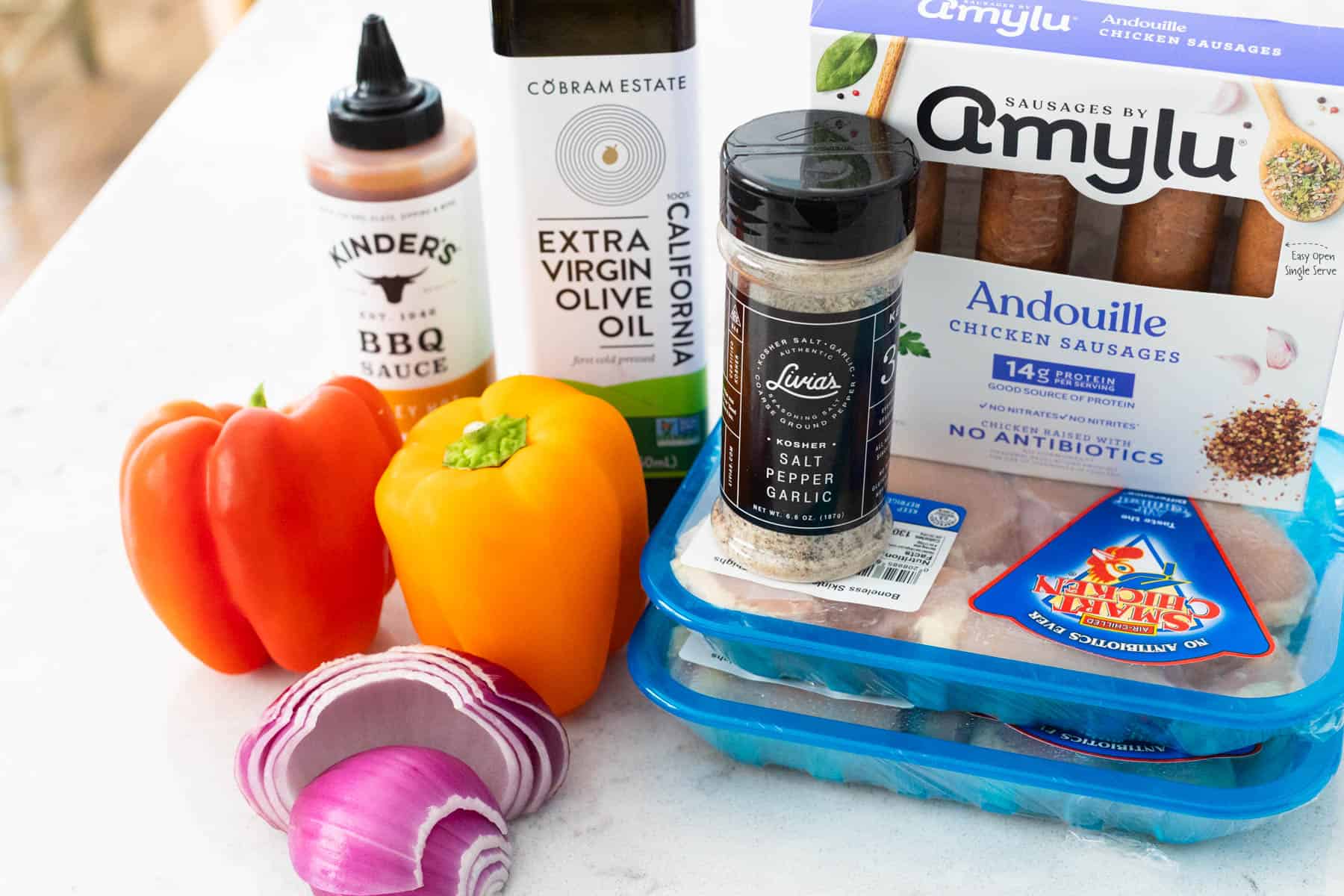 The ingredients to make baked barbecue chicken thighs are on the kitchen counter. 