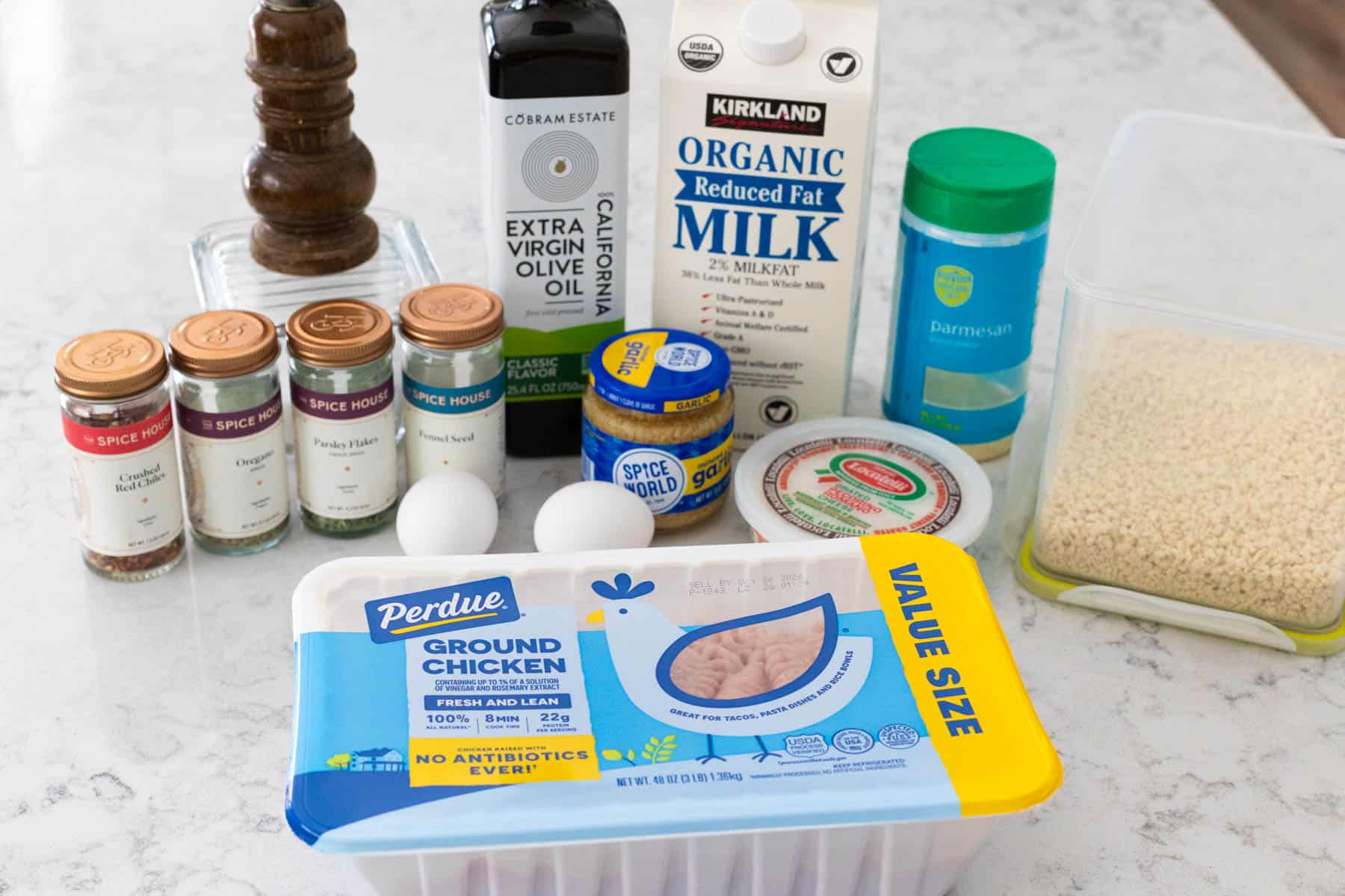 The ingredients to make Italian chicken meatballs are on the counter.